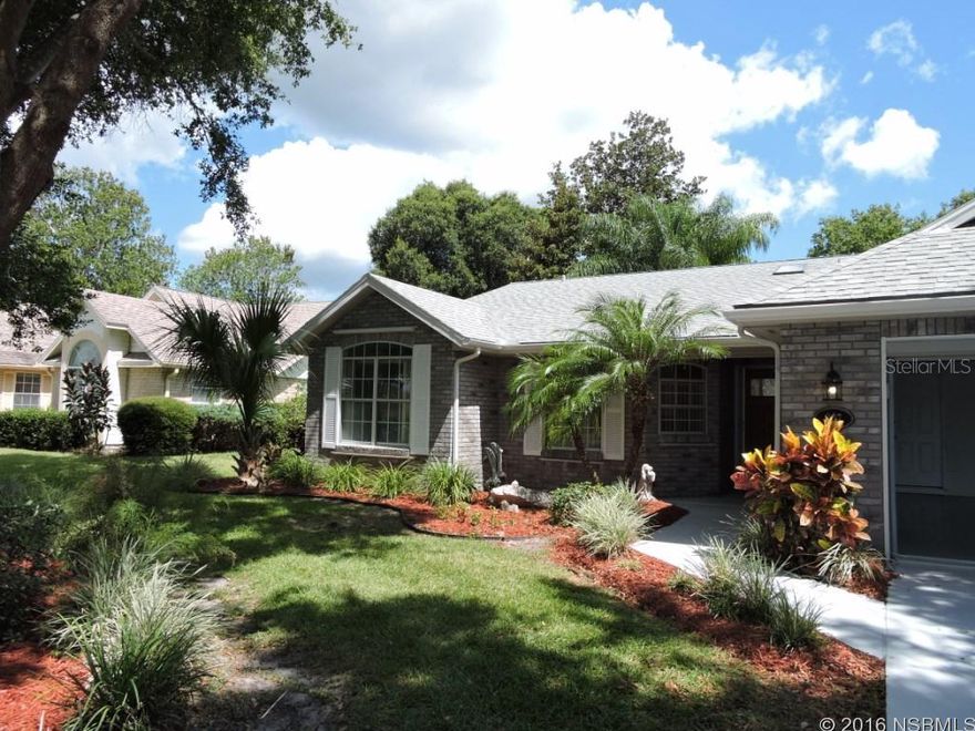 Golf-front living in spacious home that is ready to move in, freshly painted interior and exterior, new carpeting, new cabinet doors, drawer fronts and hardware throughout. New frameless glass enclosure for master suite shower. Clean, neat, bright and airy and waiting for new owners. Vaulted ceiling in living/dining formal side of the home. Relax in family room that opens to screened porch that is under main roof. Breakfast nook, family room and kitchen feature plantation shutters, including the bay window. Kitchen features Corian hard surface counters, two large pantry closets and lots of newly updated cabinets. Inside A/C laundry room with skylight. All 3 bedrooms are large, but master suite is outstanding with twin walk-in closets and plenty of room. Master bath features twin sinks, newly updated cabinets, spa tub and separate shower with new frameless glass enclosure.  Great golf-front location on 200 ft. deep lot x 80 ft. frontage, with plenty of room for your pool. If not, you are within close walking distance to community heated pool, by optional and separate membership.  Storm shutter system, double pane windows.  Low annual H.O.A. dues includes standard Cable TV service and irrigation system operation, as well as providing water to it. Owner has freshened up this lovely home to make it move-in ready, prior to putting it on the market. Make it yours! Nestled between 2 golf courses this home has a great central location, and is close to everything, including a short drive to the beach. New on market! Offered As Is, with inspections welcomed! Room sizes approximate per builder's plan. ;Water: City