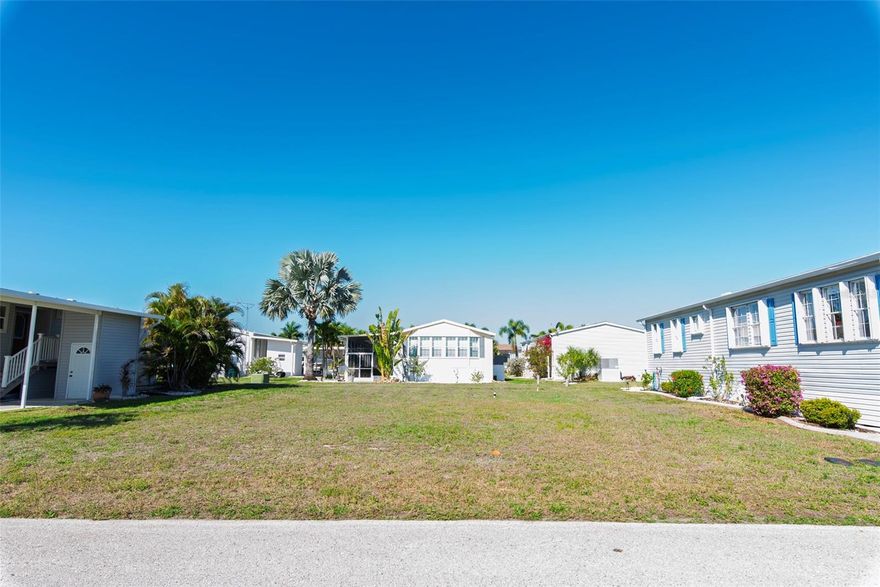Discover the perfect opportunity to craft your dream Florida lifestyle in the vibrant, resident-owned 55+ community of Windmill Village in Punta Gorda. This vacant lot serves as your ready-to-build blank canvas in one of Southwest Florida's most sought-after active adult waterfront communities, with direct access to Charlotte Harbor for effortless boating adventures, sunset cruises, or quick trips to the Gulf. Windmill Village offers an abundance of amenities designed for an engaging, social retirement: two private marinas with a boat ramp, a sparkling heated pool with a pavilion for gatherings, shuffleboard, bocce ball, horseshoes, indoor pickleball, billiards, cornhole, and a large community center hosting bingo nights, clubs, and year-round events tailored to diverse hobbies. The lot is already cleared and leveled, primed for your custom manufactured home, and the low monthly HOA fee (around $256) covers essential perks like water, sewer, trash pickup, common area maintenance, and road upkeep—delivering true hassle-free living. Note that the purchase price excludes a one-time $18,285 Buy-In Share and Bond, which is fully refunded upon resale. Conveniently located just minutes from historic downtown Punta Gorda—famed for its charming shops, waterfront dining, weekly farmers markets, and live entertainment—you're also a short drive from award-winning Gulf Coast beaches for relaxing day trips or getaways. Punta Gorda has earned accolades as a top small place to live, including recognition from Money Magazine and Forbes for its quality of life and appeal. Whether envisioning a seasonal retreat or a permanent paradise, this lot in a welcoming, well-maintained, gated neighborhood provides the ideal setting to build and enjoy an active, vacation-like every day. Don't miss your chance to secure a slice of Southwest Florida heaven in Windmill Village! Note: This lot is now vacant with no home on it.