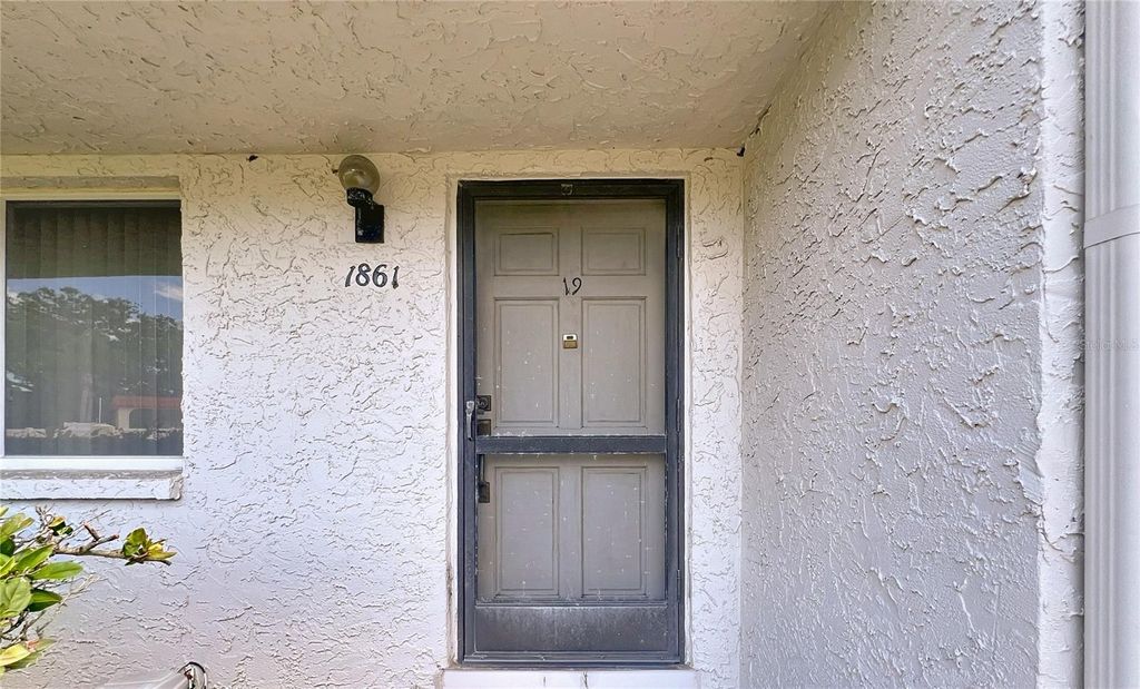 Photo of 1861 Pine Cone Cir, Clearwater, FL 33760 (MLS # TB8420684)