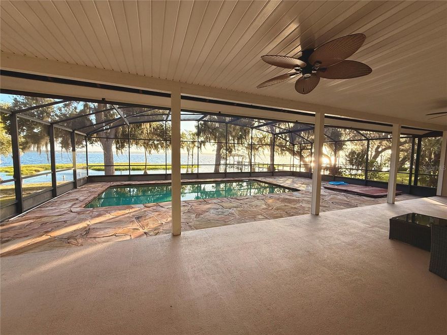 Expansive Clermont Chain of Lakes Lifestyle
Welcome to 12120 Elbert Street, a 4,437 SqFt (Property total footprint) DIRECT Clermont Chain Of Lakes, Lake Minnehaha residence. NO STREET in between home and Lake. 
This property offers a rare opportunity to live on one of Florida’s most celebrated waterways—the Clermont Chain of Lakes. Composed of 13 interconnected, navigable lakes, this extraordinary aquatic playground invites endless days of aquatic activity from Championship fishing, rowing, swimming, kayaking, paddle boarding, to sunrise and sunset enjoyment. From your own backyard you can explore miles of waterways, discover hidden coves, and enjoy direct access to waterfront dining and lively seasonal events.
Tucked lakeside, down a quiet shade lined cul-de-sac, your private retreat captures unforgettable sunrise views and the peaceful rhythm of waterfront living. Inside, expansive gathering areas flow to a Tennessee flagstone lined pool and spa overlooking Lake Minnehaha, while telescoping sliding doors frame the ever-changing scenery. Whether enjoying a leisurely morning cup of coffee, an afternoon of boating or  hosting friends for an evening on the patio, every moment here celebrates a lifestyle defined by tranquility, recreation, and natural beauty.
Clermont itself is a destination of natural beauty and vibrant energy. Known for its rolling hills and elevated vistas, the area provides a striking backdrop rarely found in Florida. Clermont’s picturesque community features a thriving Historic District, scenic parks, and trails that draw visitors year-round. Beyond its unique landscape, Clermont has earned an international reputation as a world-class training center for elite athletes, including triathletes and Olympic competitors, who come to take advantage of the area’s terrain, pristine lakes, and temperate climate.
Discover why Clermont is treasured by locals and admired by visitors worldwide—an unparalleled combination of small-town charm, outdoor adventure, and breathtaking lakefront living awaits at 12120 Elbert Street.

Home Warranty Provided by Seller at Time of closing.