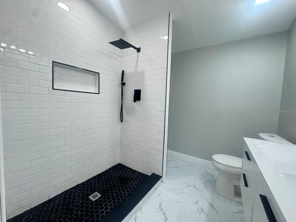 Photo of 10118 Alambra Avenue, Tampa, FL 33619 (MLS # TB8428014)