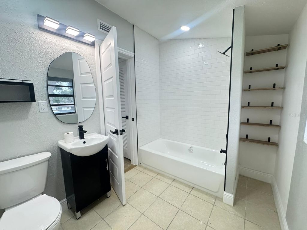 Photo of 10118 Alambra Avenue, Tampa, FL 33619 (MLS # TB8428014)