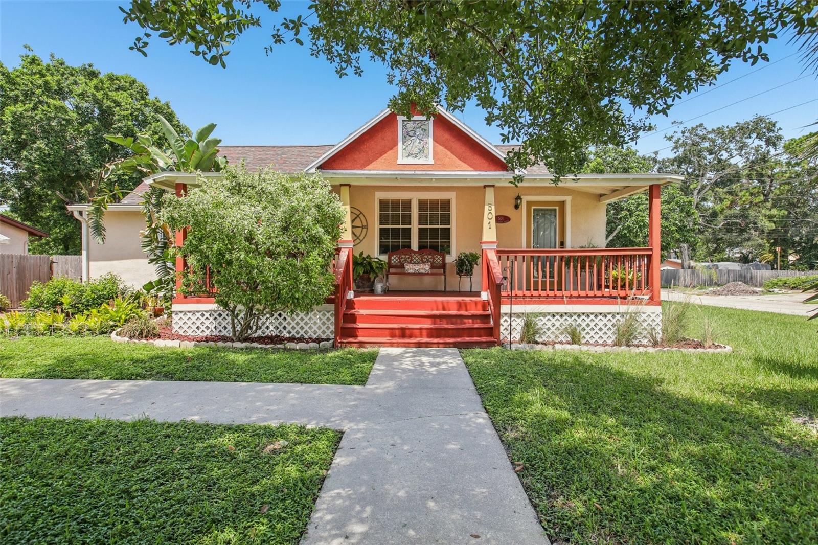 Built in 1900 with beautiful red oak floors, this truly unique home marries classic St. Petersburg design with the convenience of modern living. Situated on a large, fenced-in, HIGH and DRY oversized corner lot, the home has excellent curb appeal and is located in the desirable Five Points neighborhood, only blocks from downtown and the multitude of shopping and restaurants offered along 4th Street North. The area is a blend of both historic and newly constructed homes. The interior exhibits the cozy feeling of New England along with a modern kitchen and well lit dining room overlooking a very spacious back yard, that could easily accommodate a large pool or family gathering.
The first floor master bedroom is beautifully appointed and features a full sized master bathroom and large laundry room that would save steps and heavy lifting. Another unique feature is a rear entrance from the deck into a large storage room and stairway that accesses a very sizeable space upstairs that could become a bedroom, office or even an apartment. Other unique features include two large sheds in excellent condition and a bright Florida room to enjoy a good book and glass of wine. This unique home offers a lifestyle rarely found in today's market.