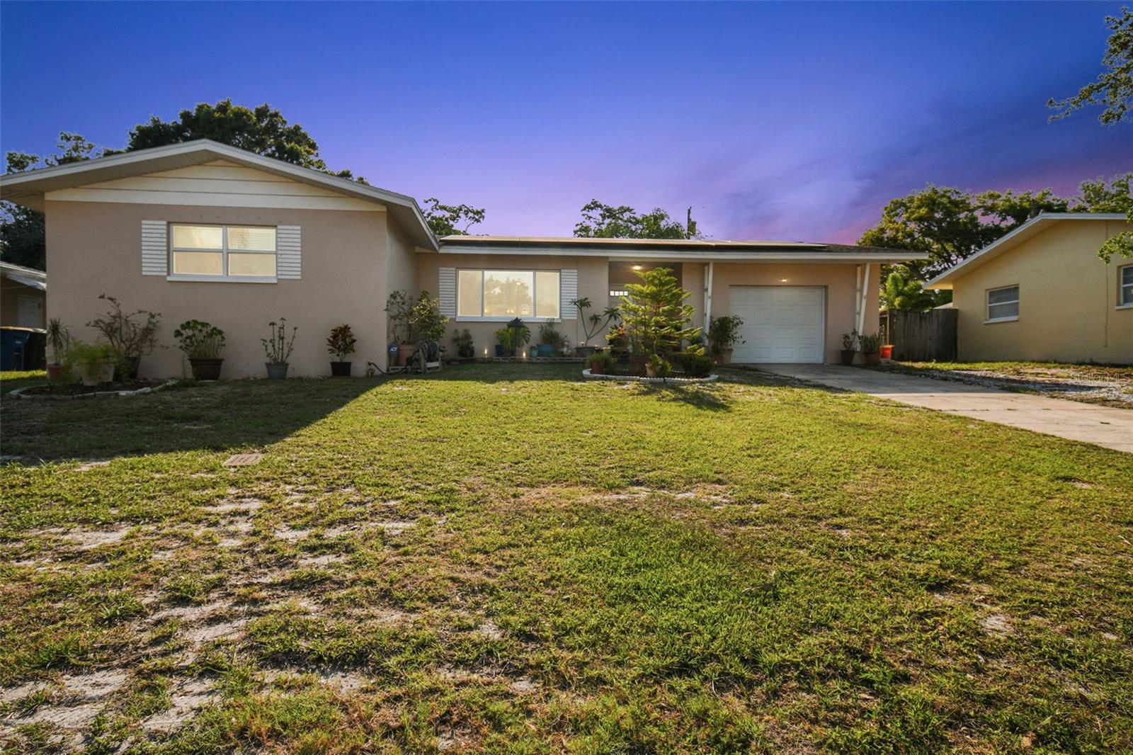WOW Seller says sell this POOL HOME :0) Price improved to sell now!! You can buy this beautiful pool home, now just in time for summer!!! Located in world famous clearwater just minutes from prestine top 10 beaches in the US. House includes PAID OFF SOLAR PANELS (owned not leased), so power bills are super low (between 60-120 month). Updates include: (Solar panels seller believes its a 20 year transferrable warranty), HVAC replaced June 2022, Pool Surface updated fibertect to fiberglass June 2018, Windows were redone appx 2018, Floors replaced 2023, Roof replaced 2016, and more. Home completely rewired June 2023 (no cloth wiring). 3 bedrooms 2 bedrooms and has SEVERAL beaches LESS THAN 10 miles from home! When you approach, appreciate the mature Florida landscaping and new (hurricane fabric) windows! As you enter, value how open this homes floorpan is with the living room on your left, dining room on your right and kitchen adjacent with lots of cabinet space, tile floors, a serving window, eating space in the kitchen and STAINLESS STEEL APPLIANCES! The garage is next to the kitchen, in the garage is the laundry room with extra storage! The family room comes with two ceiling fans, crown molding, blinds, fireplace, French doors with built-in blinds, has tile floors and a spacious storage cabinet! First bathroom has tile floors with a tub with shower and a door (with blinds) to go to and from the pool! The first and second bedroom have blinds and double closet doors! Down the hallway on the left has a couple closets with LOTS of space for all of your items! In the master bedroom cherish the TWO closets for his and her side, blinds and how roomy it is. Mater bathroom has tile floors with a stand up shower and frosted windows for privacy! This home also features a wooden fence around the backyard, very homey feeling, PAID OFF SOLAR PANELS and much more! You don't want to miss out on the MANY things to do close by including: TONS of beaches, Clearwater Marine Aquarium, several nice parks, Florida Botanical Gardens Country Club, lots of places to grab a bite to eat and at the end of the day you can watch the sunset right on the water! There's much more so close to this home like a local hospital, many grocery stores, shopping plazas, and far more places to explore! Check out this BEAUTIFUL home before it's gone!