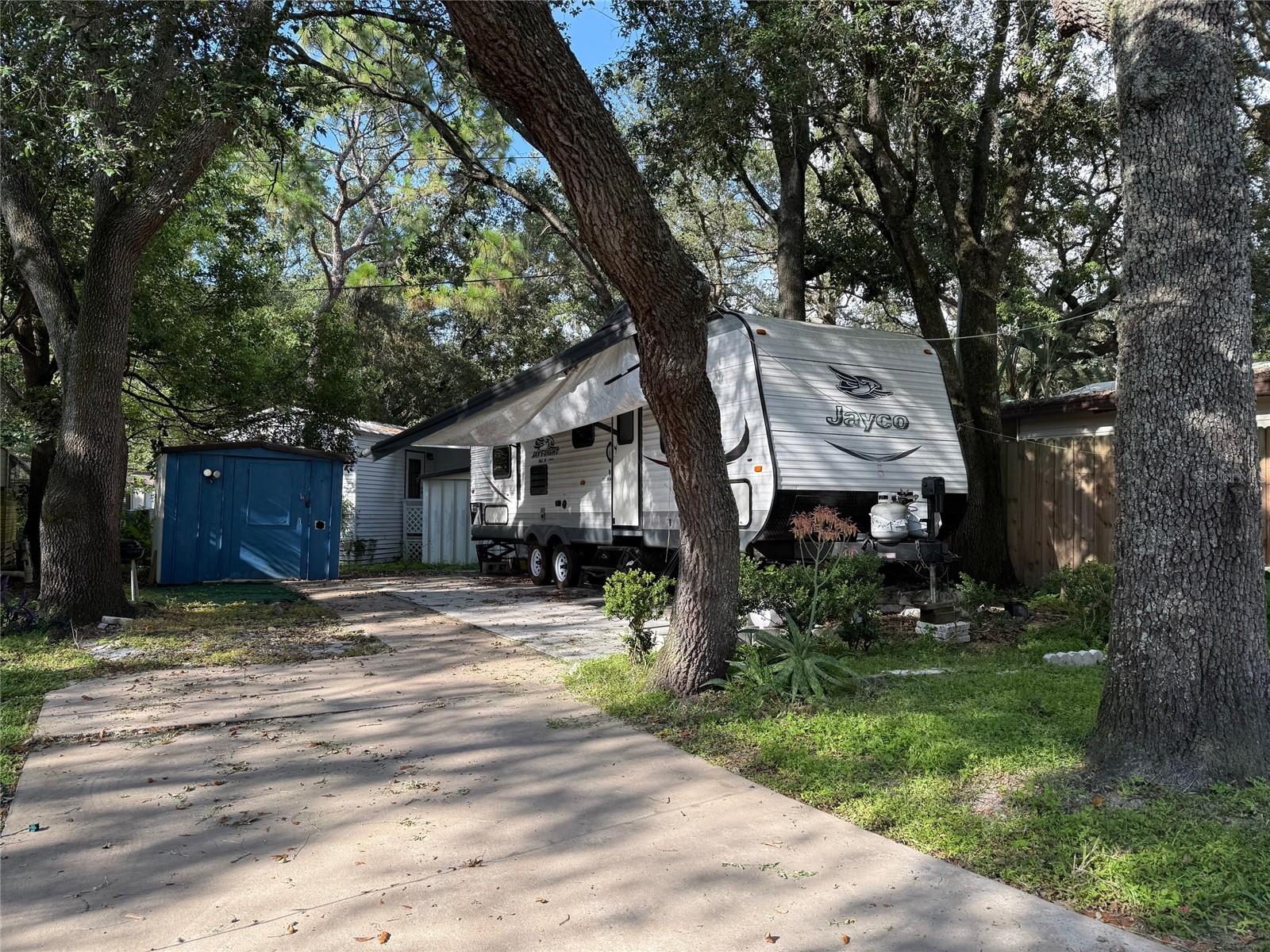 1 bedroom 1 bathroom trailer in a gated RV park. Private lot in a RV park. Concrete pad for sitting and a utility shed for extra storage. Size is perfect for one or two occupants. Partially furnished, No Pets. Located near West Orange trail and close to bus route, shopping, hospital, 30 minutes from Disney. Rent includes water, sewer, garbage pick-up, gated community with virtual guard, swimming pool, basketball, shuffleboard, mini-golf and much more.