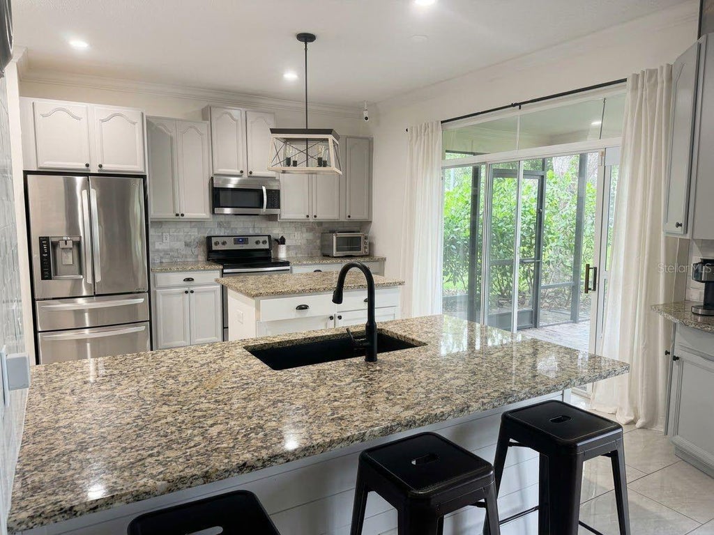 Photo of 389 Lakepark Trail, Oviedo, FL 32765 (MLS # S5156756)