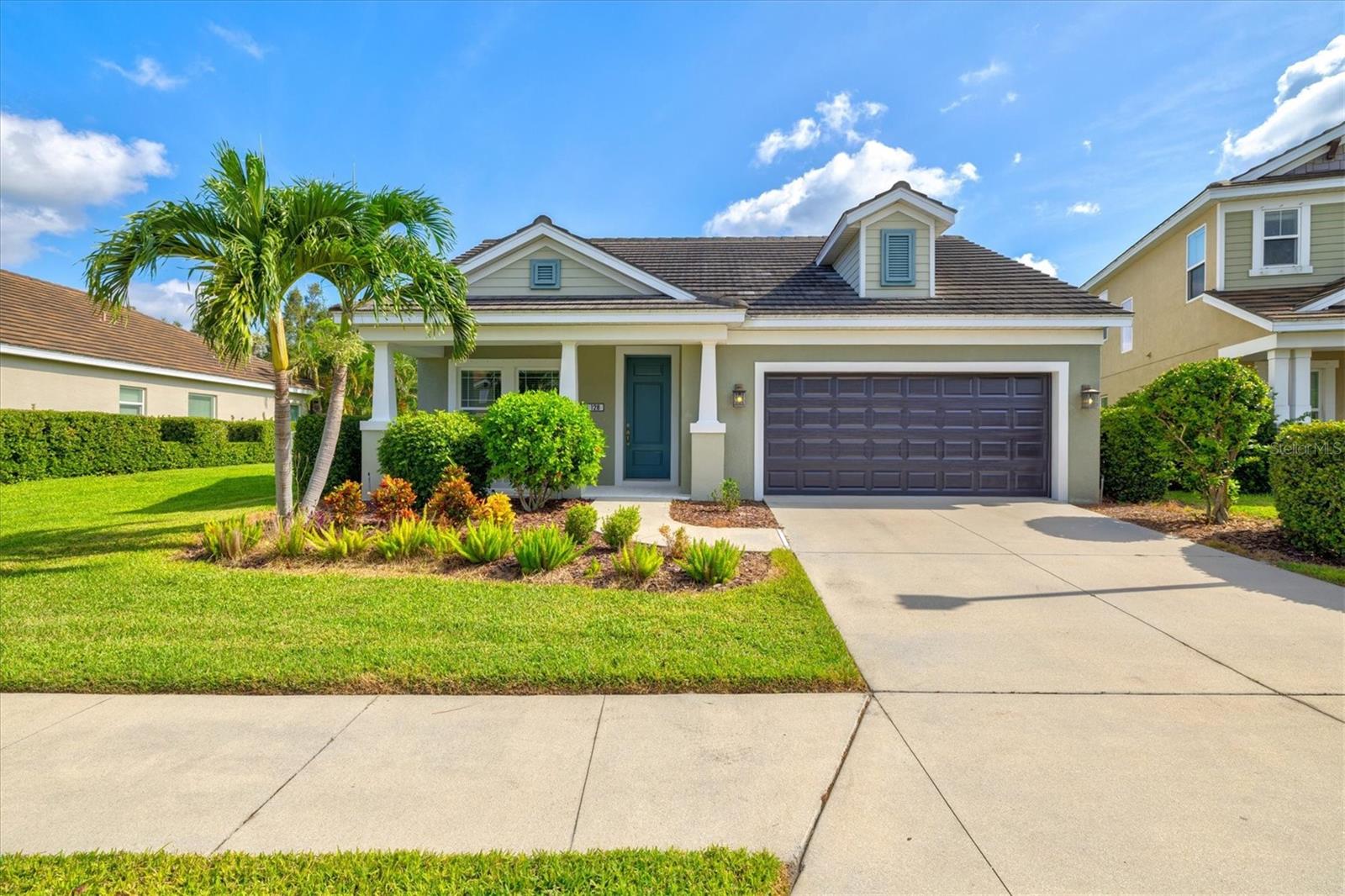 Welcome to Windwood, a gated Neal Communities neighborhood. This move-in ready Applause model has been thoughtfully designed by a certified interior designer with elegant touches throughout, including crown molding, tray ceilings, premium tile floors, plush bedroom carpeting, and designer lighting. The kitchen offers exceptional style and function with quartz countertops, stainless steel appliances, white shaker cabinets, and a premium vertical set backsplash—all complemented by a timeless neutral palette. Enjoy peaceful pond and nature views from both the living room and primary suite with no homes behind you for added privacy. Natural gas connections are already in place for a dryer, range, lanai grill, and water heater, adding to the home’s everyday conveniences. Perfectly situated, this home is just minutes to I-75, 5 miles from Nokomis Beach, and only 4 miles from the shops and restaurants on Venice Island—offering the best of Florida living right at your doorstep. This model-perfect residence is the ideal blend of comfort, privacy, and location—ready for you to call home!