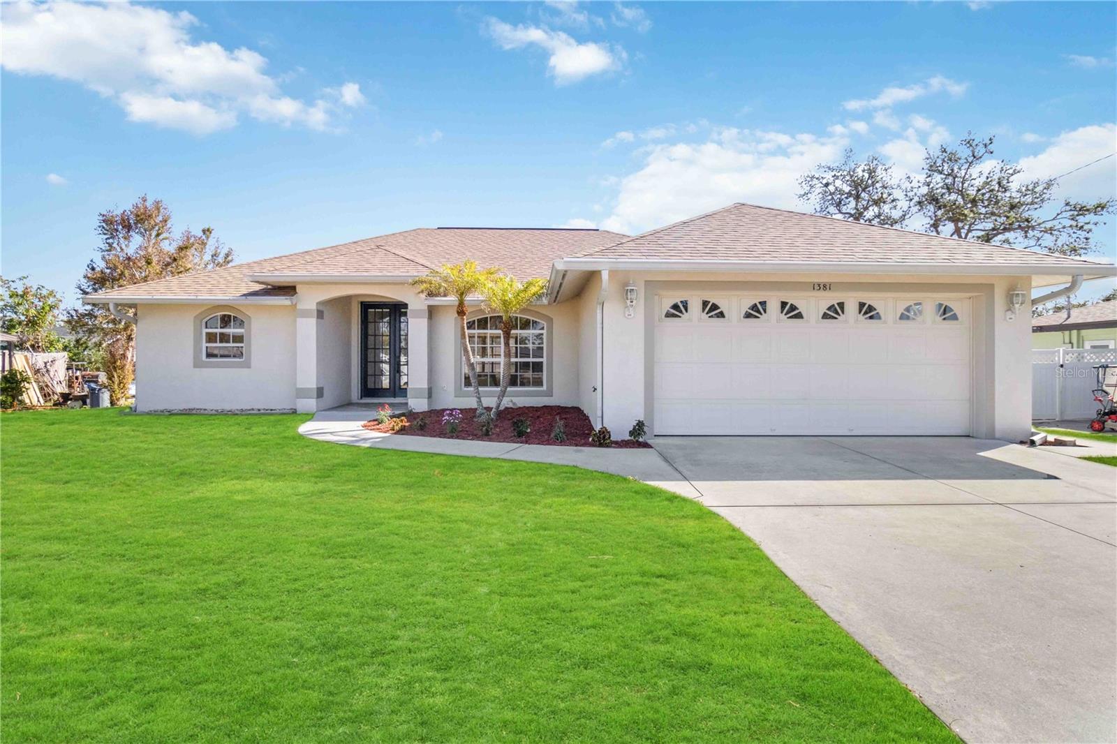 **Massive $45k price drop!!** Welcome home to 1381 Nantucket Rd, Venice, FL! This charming 2-bedroom, 2-bathroom single-family home offers 1,634 sq ft of comfortable living space on an 8,000 sq ft lot. Built in 2003, this well-maintained property features a spacious open floor plan, perfect for both relaxing and entertaining. Step inside to find a bright and airy living area with large windows that let in plenty of natural light. The modern kitchen boasts ample counter space, sleek cabinetry, and a convenient breakfast bar. The master suite includes a generous walk-in closet and an en-suite bathroom with dual sinks and a walk-in shower. This home has been recently updated with a BRAND NEW ROOF, FRESH PAINT THROUGHOUT, and NEW CARPET, ensuring a move-in ready experience for the new owners. Enjoy Florida's beautiful weather in your private backyard, complete with a covered patio ideal for outdoor dining and lounging. The attached garage provides secure parking and additional storage space. Located in a quiet and very friendly neighborhood, this home is just minutes away from local schools, shopping, dining, and the stunning Gulf Coast beaches. Don't miss the opportunity to make this lovely house your new home!