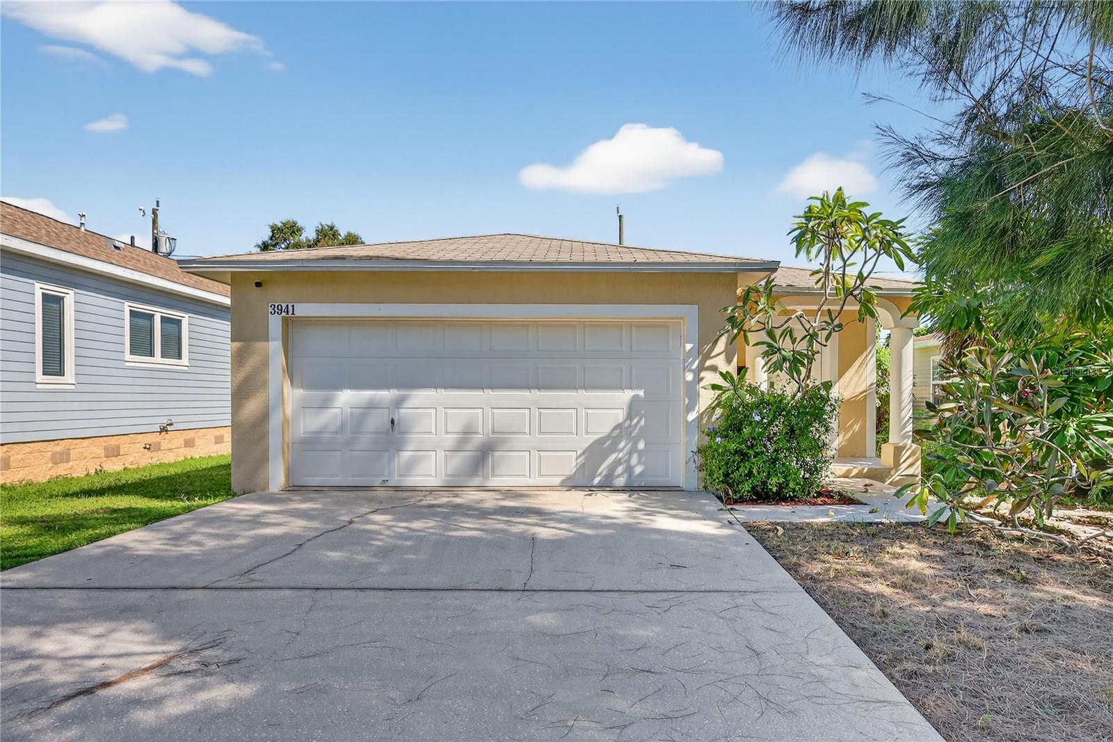 Move-in ready 3BR/2BA block home with 2-car garage in the desirable Central Oak neighborhood! This home offers an open floor plan with fresh interior paint, new carpet in the bedrooms, and abundant natural light. The kitchen features stainless steel appliances, crisp white cabinetry, and a center island that flows seamlessly to the dining and living areas. The spacious primary suite includes sliding glass doors that open to the fully fenced backyard, perfect for pets, gardening, or entertaining. Additional highlights include indoor laundry with washer/dryer, a large garage for parking or storage. Just minutes to vibrant Grand Central District with its award-winning restaurants, breweries, shops, and art galleries, and a short drive to downtown St. Pete, Tropicana Field, and our world-class Gulf beaches. A great opportunity to own in a growing neighborhood close to everything!