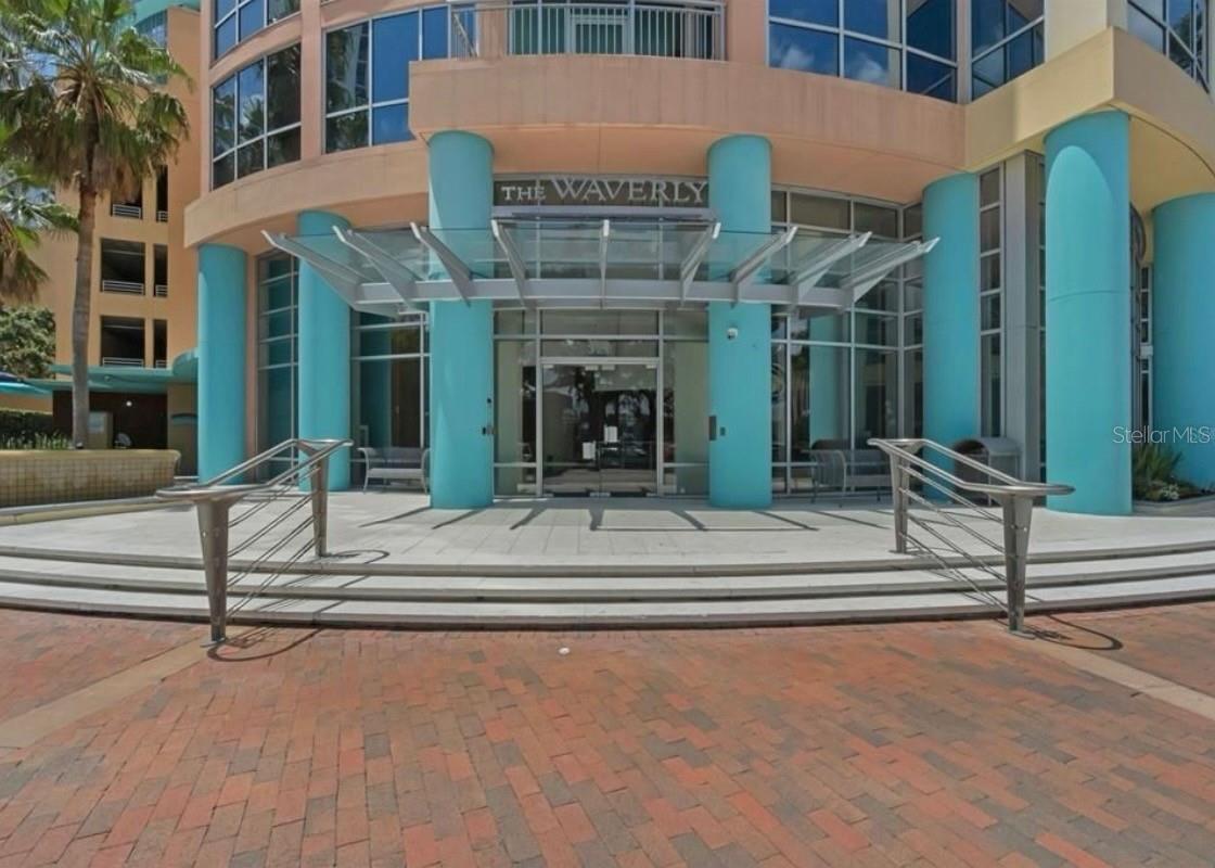 Skyline views? Check. Fireworks? Check. Publix across the street? Double check. Perched on the 12th floor of one of Orlando’s most iconic high-rises, this fully renovated 2-bedroom, 2-bath condo offers a lifestyle that blends luxury, convenience, and unforgettable views. The Waverly’s unbeatable location puts you right between the buzz of Church Street and the relaxed vibe of Thornton Park — with Lake Eola quite literally in your front yard. Publix is across the street, and dining, shopping, and nightlife are all within steps of your door. Inside, the home features an open-concept kitchen with quartz countertops, sleek cabinetry, and brand-new stainless steel appliances. Vinyl wood flooring runs throughout, creating a modern, low-maintenance finish. Floor-to-ceiling windows flood the living room and primary suite with natural light and sweeping skyline views, while the en-suite bath and generous walk-in closet add comfort and function. A second bedroom and full bath make the space perfect for guests, a home office, or flex living. Step onto your private balcony to take in the city lights — and even Disney fireworks in the distance. The Waverly delivers resort-style amenities, including a sparkling pool and spa with cabanas, a fitness and business center, grilling stations, concierge service, a 24-hour doorman, and secure assigned parking. Impeccably maintained and vibrant, this building is known for its friendly community and unbeatable energy.