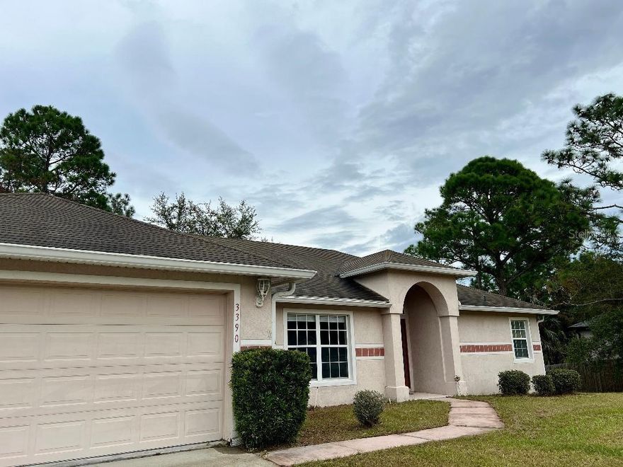 Spacious open floor plan for this 3 bedroom 2 bath home with volume ceilings.  Large kitchen with all stainless appliances.  Huge master bath with garden tub and separate shower.  Large interior laundry room with hook ups.  Screened patio overlooking over-sized fenced lot with  attached garage.  Fresh interior paint and new carpet.