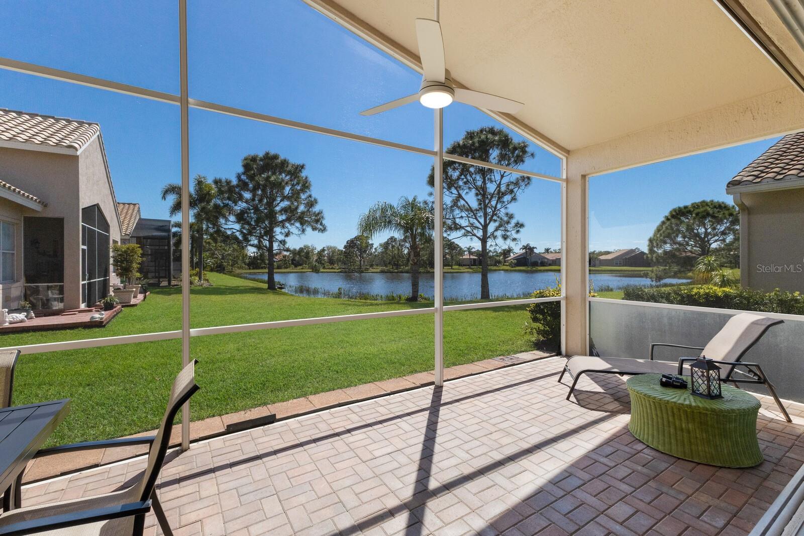 Beautifully positioned along the largest lake within the Cascades, this refined single family home offers an exceptional resort-style living experience. The 2,008-square-foot ST KITTS showcases 10-foot ceilings accentuated with dramatic crown molding, while engineered hardwood flooring flows throughout the great room and gathering spaces. For upmost convenience this Smart Home incorporates Wi-Fi controlled thermostat, garage door function, lighting and door lock security, all from the touch of your smart phone.
The thoughtfully updated kitchen is a chef’s delight, featuring: solid wood cabinetry, stone countertops, and sophisticated details, including under cabinet lighting, integrated dish display rack, suspended wine glass display, stainless range hood and central vacuum floor sweep. Expansive 8ft pocket-sliding glass doors frame tranquil water views and lead to a covered and screened 25x10 lanai - an ideal setting for sunset dining and relaxed conversation. Of course, with the glistening lake in view.
The primary suite features a luxurious en-suite bathroom complete with dual vanities, new touch control back-lit facial mirrors, stone counters, whirlpool bath + separate shower. Both walk-in closets feature custom storage transformation by Closet Design. Master bedroom space easily accommodates king furniture. A dedicated den provides the perfect work-from-home environment, or can easily become a 3rd bedroom. St Kitts plan positions the guest BR next to the den with a full bath in-between. The two-car garage was not forgotten and includes high quality epoxy non-slip flooring and lots of custom storage cabinetry.
The laundry room is spacious and thoughtfully designed with pedestal front load washer and dryer, a furniture quality cabinet with porcelain sink and very convenient folding counter.
The Cascades is renouned in Sarasota for its exceptionally beautiful club house, pro-quality HarTru tennis courts, pickleball, bocce courts and complete fitness facility.But the coup de gras is the Indoor-Outdoor pool with name inspiring cascading waterfall that divides indoor and outdoors. Included in the very reasonable HOA is ground maintenance, Fiber Optic cable and Wi-Fi, full time manager and sports director and regular live entertainment, very active travel club. This is what resort style living is all about. Set up a tour and be inspired to call Cascades your new home in paradise.