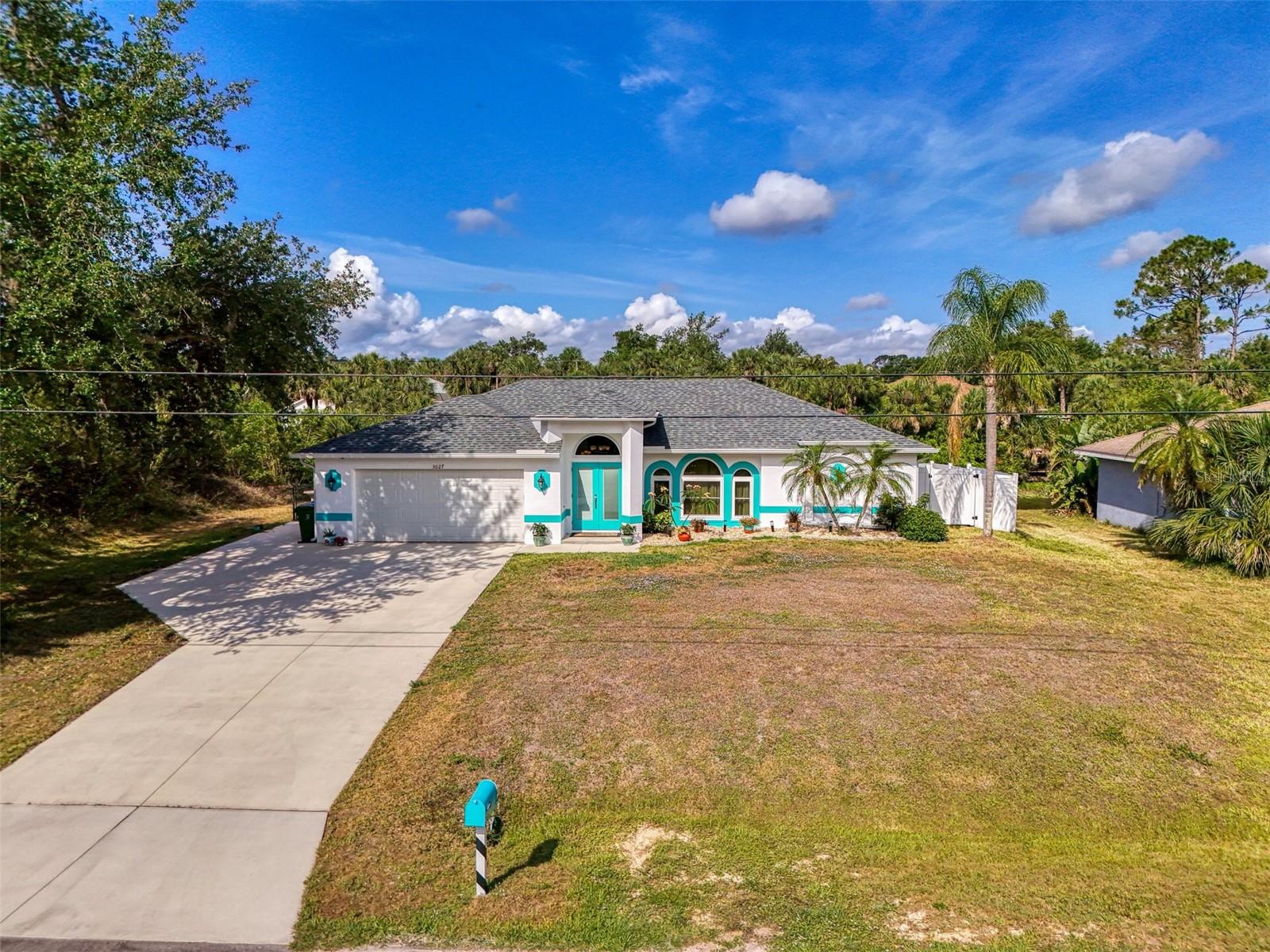 This beautifully updated pool home is move-in ready and packed with upgrades, charm, and space! With over 1,700 square feet of comfortable living area, this 3-bedroom, 2-bathroom, 2-car garage home sits on the scenic Blue Ridge Canal—where you can fish or kayak right from your backyard. No flood insurance is required, and the entire home is hurricane protected with impact-rated windows, doors, and Storm Shield shutters across the lanai. The moment you walk through the grand double front doors, you'll step into a massive great room with soaring cathedral ceilings and graceful arched windows. Natural light pours in, and your eyes are immediately drawn to the sparkling blue pool just beyond the sliding glass doors. The outdoor area is peaceful and private, with a fully fenced yard, lush landscaping featuring flowering shrubs, palm trees, concrete curbing, and decorative multi-colored rock. A charming brick paver wall adds style to the back of the yard while offering a front-row seat to passing birds and wildlife. The upgraded kitchen is a showstopper—featuring granite countertops, a spacious breakfast bar, wood cabinetry with pull-out drawers, and newer stainless steel appliances (just a couple years old). It’s perfect for everyday cooking or entertaining. There’s even a reverse osmosis water system under the sink for clean, fresh drinking water. The large primary bedroom includes two walk-in closets and a private door to the pool area. The ensuite bathroom offers dual sinks, a big walk-in tiled shower, and a separate toilet space. On the opposite end of the home, you’ll find two guest bedrooms and a full bathroom with a tub/shower combo. Additional features include a roomy laundry area with washer, dryer, and utility sink, plus a garage workshop area with tool wall and workbench. Newer upgrades include a resurfaced and tiled heated pool, pool cage screening, new roof (2020), updated gutters, security system, water softener, and even an added side driveway for your RV or boat. Located near Blue Ridge Park and just minutes from shopping, dining, and Gulf beaches—this home checks all the boxes. Schedule your private tour today!
