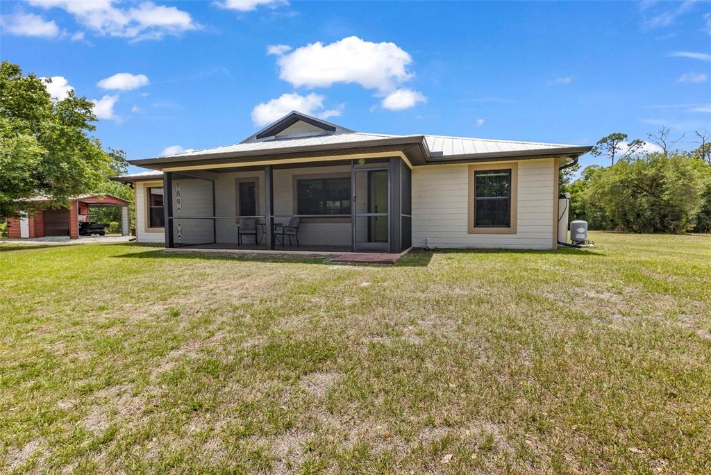 Photo of 24549 Tangerine Avenue, Port Charlotte, FL 33980 (MLS # C7525564)