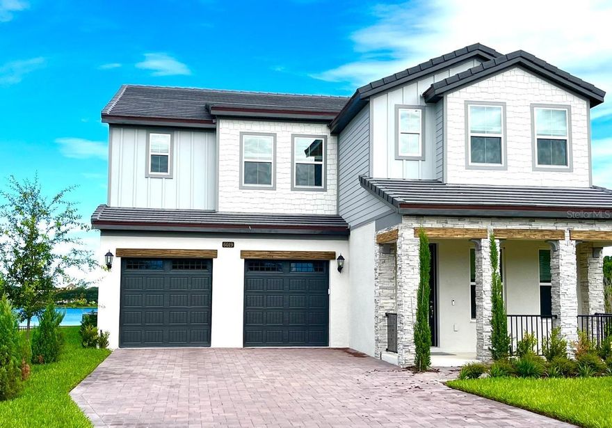 Nature-lovers and stargazers' paradise. Brand new waterfront home with lake access. Impressive bright open floor plan with many upgrades - stairs in wood planks, metal handrails, lighted cabinets, contemporary appliances, huge granite kitchen countertops, a floating bathtub in the master, and much more. A second master downstairs. Loft/bonus room on the second floor, which can be used for kids' play or a media/TV room. The most astonishing lake view from the master balcony. The community pool is located across the street from the home. Adding to all the features is this home's exquisite location within the Dr. Phillips area, close to the theme parks, major highways, great malls, and the famous "restaurant row"off Sand Lake Road.