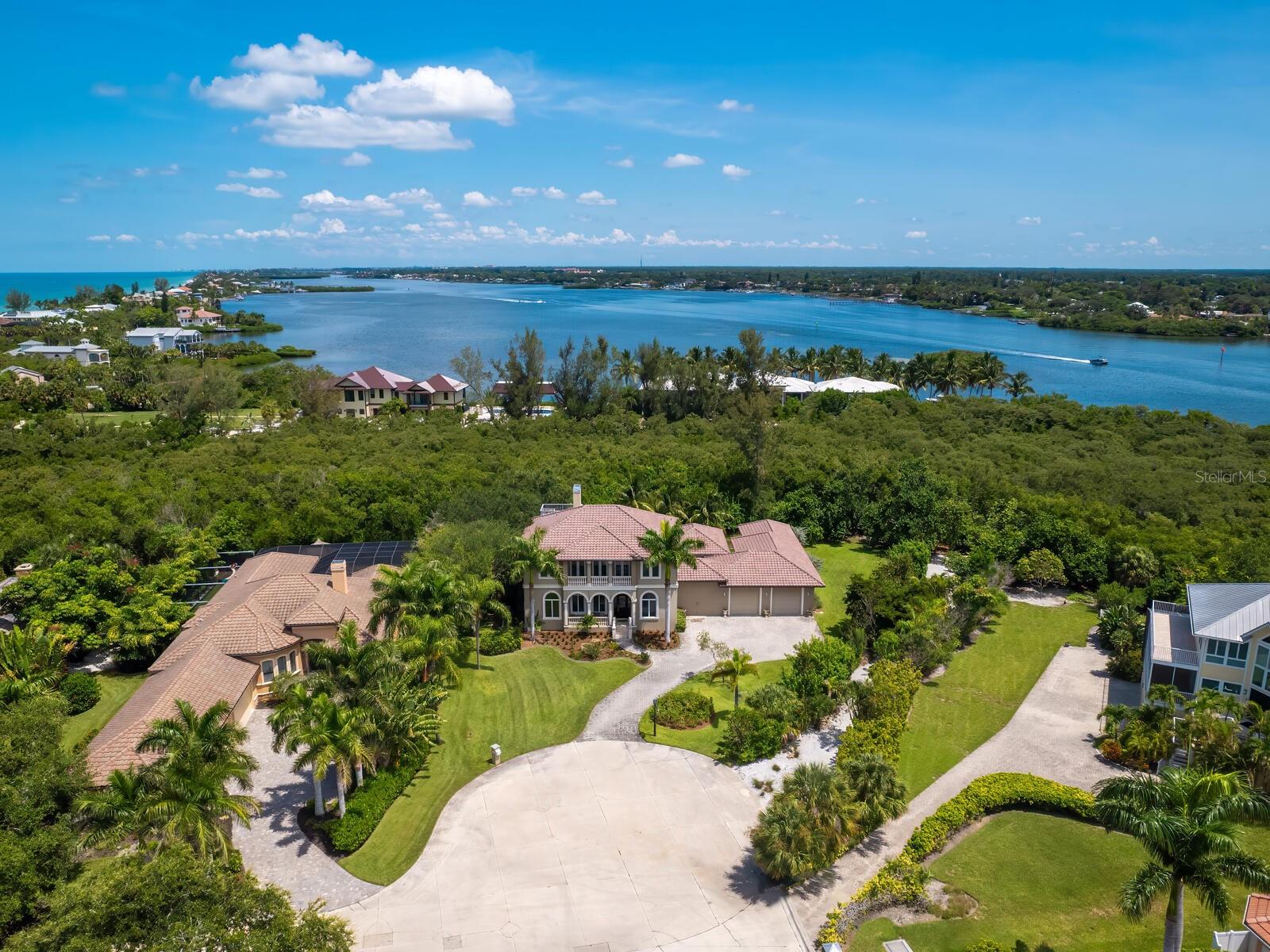 Rarely available on Casey Key. This stunning two-story custom home is located in the only private gated community of Casey Key Estates. A blend of luxury and practicality perfect for a refined lifestyle. The 2022 remodel includes an elegantly updated kitchen, a butler's pantry, modern baths, a laundry room, natural wood flooring, a new roof, and a full home generator—ensuring both beauty and functionality. On the first level, you'll find a picturesque view of the pool, an expansive kitchen and a great room with a stunning fireplace, a formal dining area, a private office/den, and a spacious primary suite. The second level features three guest bedrooms, a second living room, and a balcony offering serene views of Casey Key. The oversized garage caters to car enthusiasts, while the beautifully landscaped property provides privacy and tranquility. Enjoy the spectacular pool and spa, surrounded by custom travertine and a covered outdoor area designed for seamless entertaining. The game room is versatile, suitable for games, a workout space, or a separate home office. Located in the desirable Casey Key Estates neighborhood, you'll have access to park-like deeded beach access to the Gulf of America, a private gate, pickleball and tennis courts, an Intracoastal fishing pier, and a kayak launch. Currently available for sale or lease. This is more than a home—it's a gateway to your dream Florida lifestyle!