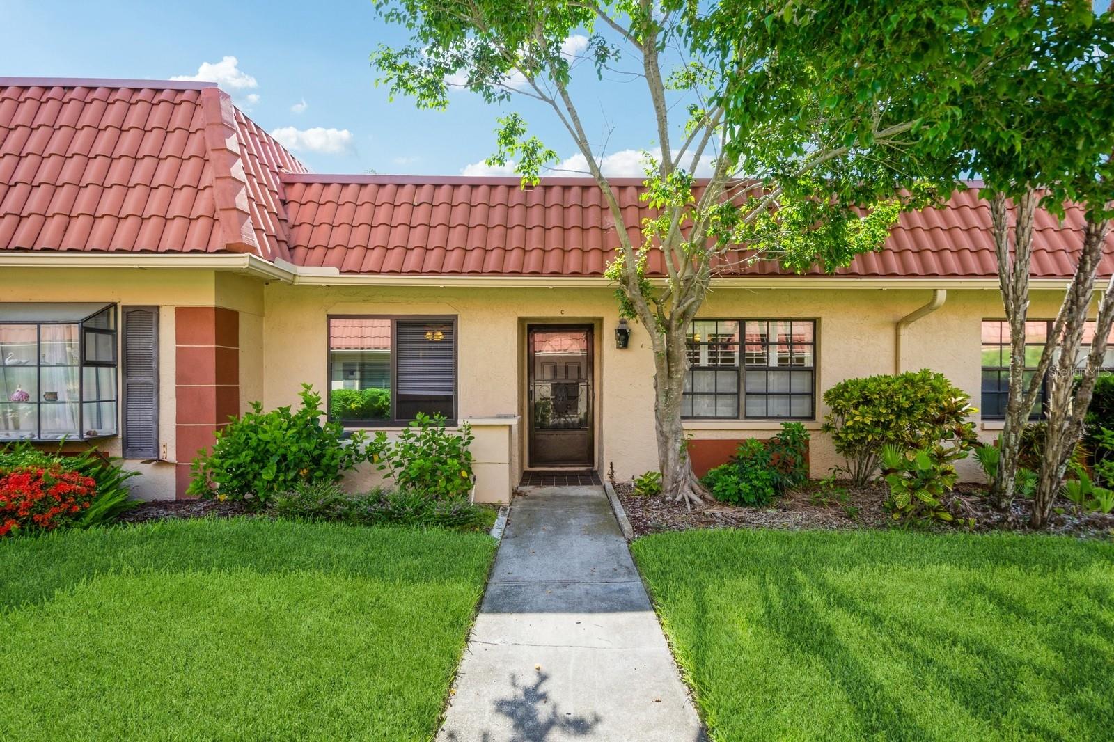 Welcome to this move-in ready one-story villa nestled in the sought after 55+ community of Imperial Cove. You will fall in love with the open concept floorplan with Luxury vinyl plank throughout all main living areas. The kitchen has updated with granite countertops, and a large breakfast bar. The Dining and Living Room combo offers plenty of space for entertaining. The oversized Primary bedroom features ensuite with shower, vanity with dual sinks and a walk-in closet along with a secondary closet. The spacious secondary bedroom is perfect for guests along with plenty of storage and easy access to the secondary bathroom.! The laundry room comes with a washer and dryer and provides extra storage for essentials. At the back of the home is a flex space/den which offers extra space to relax as well as provide access to the pavered patio. You will love the amenities this waterfront community offers- pool, fitness center, sauna, shuffleboard courts, fishing pier, putting green, outdoor grilling area, library and boardwalk along Old Tampa Bay. This community is centrally located to Clearwater Beach, shops restaurants and easy access to Tampa International airport and St. Pete/Clearwater airport. Come enjoy the Florida lifestyle