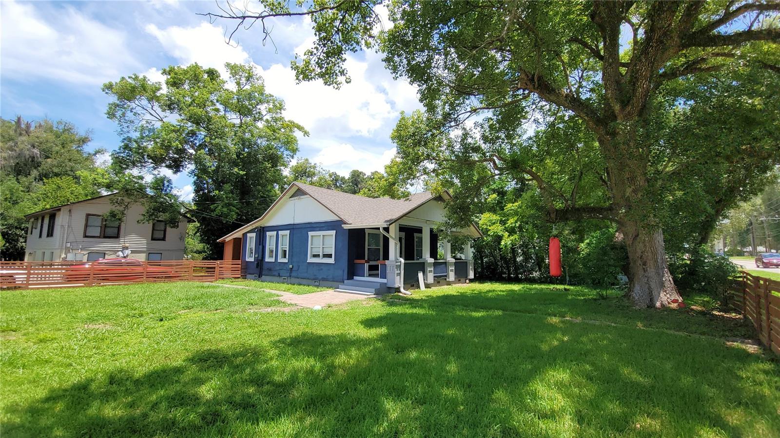 Nestled in the heart of DeLand, this absolutely adorable and irresistibly charming bungalow looks like it was plucked straight from the pages of a magazine. Step onto the inviting covered front porch and into a bright, cheerful, and fully updated farmhouse-style retreat brimming with character. Inside, you'll find modern finishes, volume ceilings, graceful arches, a classic farmhouse sink, and high baseboards that add to the home's timeless appeal. The kitchen features a new dishwasher, and the fenced yard offers privacy and space to enjoy the outdoors. Practical updates include a roof that's less than two years old, a tankless on-demand water heater, and a new AC system installed in 2017. This gem is the perfect blend of style, comfort, and convenience.