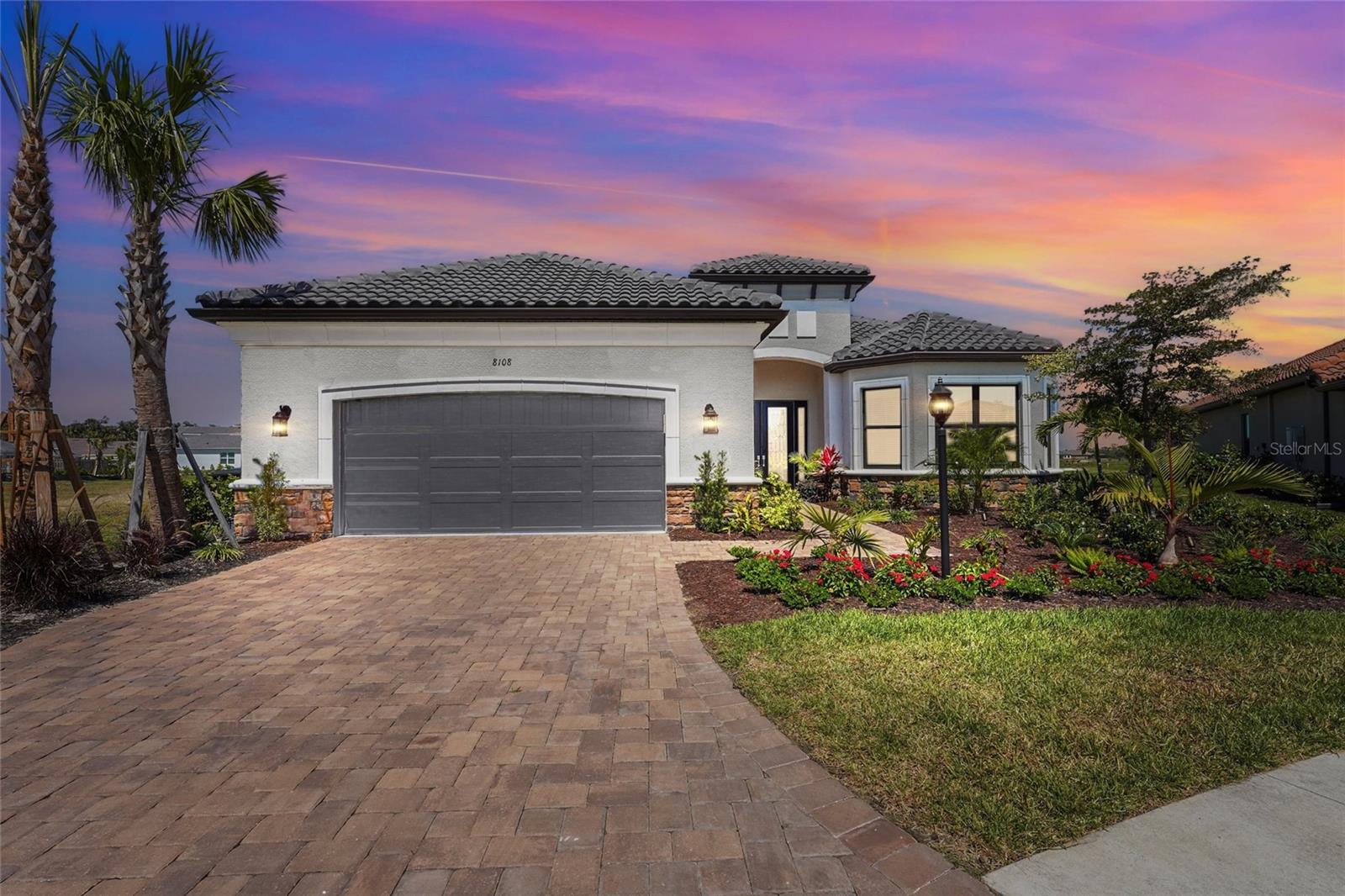 Rarely available 3 bedroom, 3 bathroom plus bonus room upgraded 3,051 sq.ft. Palazzo model in the much sought after community of Esplanade at Skye Ranch. With an unobstructed view of acres of wetlands, with concrete trails, behind the home, this is a must-see home! Upgrades throughout the entire home to include upgraded celling fans, chandeliers, closets, dining room built in mirrors and wood framing, flex room shiplap, ¾ HP garburator, and much more. The chef’s kitchen features an oversized custom island and Calcutta gold quartz counters, marble backsplash, a granite composite sink, pendant lights, and much more. Built for outdoor entertaining, this home features a a 32’ x 25’ covered lanai as well as a screened 50’ x 19.5’ screened cage. The outdoor area also is upgraded with marble travertine, new outdoor kitchen with overhead vent, refrigerator, grill and sink as well as Nebulus built in cage lighting. This home is hurricane ready with hurricane impact windows and sliders as well as a lanai remote control hurricane curtains. Esplanade at Skye Ranch, a sought-after master-plan community with 1,000+acres of lakes, 387 preserve acreage and over 25 miles of walking trails. Future plans exclusive to Esplanade residents only will include a Bahama Bar/restaurant and an additional pool. Esplanade residents will also have access to the main Hub amenities that include rock climbing wall, state of the art gym, cafe, tennis courts, dog park, sports courts, sand volleyball and a fire pit. A new K-8 school within Skye Ranch will be opening in the fall of 2025. World class medical facilities, airport, UTC shopping mall, dining, cultural events and straight shoot to Siesta Key beaches.