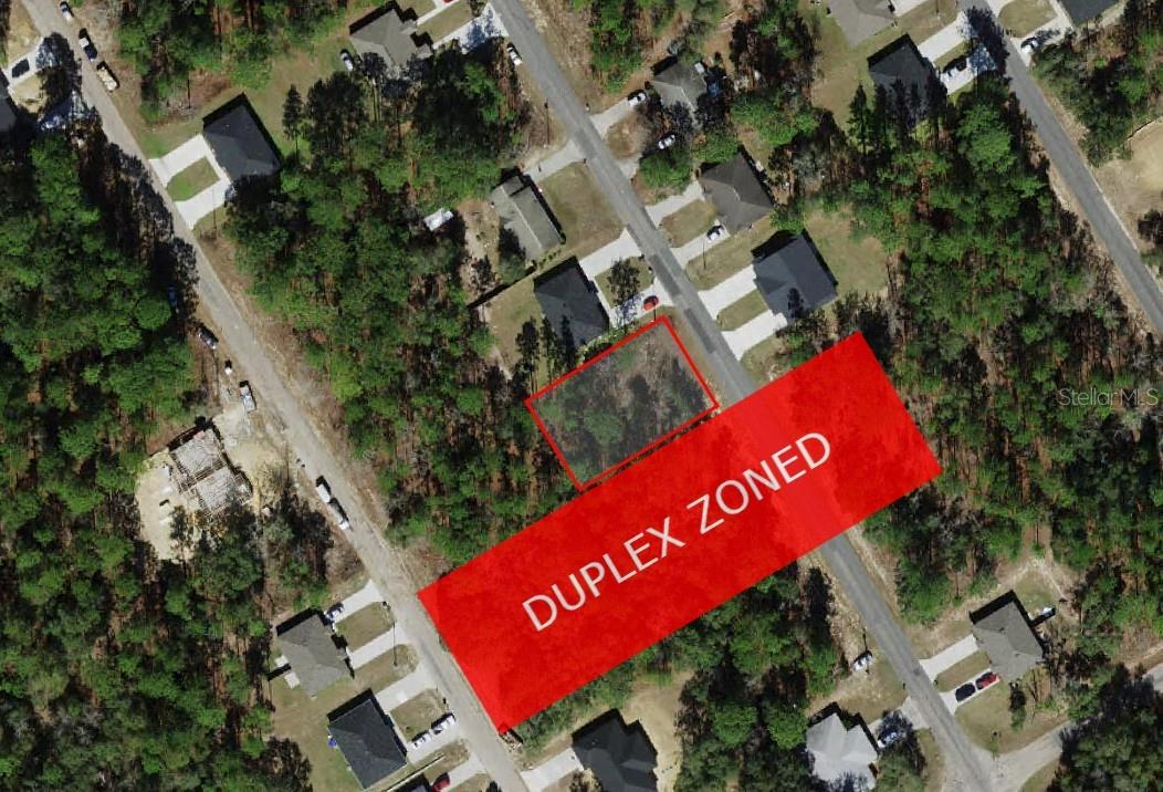 **DUPLEX ZONED** Seize the chance to own prime multifamily land in Citrus Springs, zoned perfectly for a duplex. This level lot sits flush with the street, making construction easier and more cost-effective, with water connections already available. Located in a thriving neighborhood with established infrastructure, it’s ideal for generating rental income or housing multiple families. A duplex here offers dual rental streams or the option to live in one unit while renting out the other, maximizing your investment. Multifamily properties in this growing area see strong demand, promising stable income and potential long-term appreciation. Enjoy freedom from HOA fees and nearby community amenities like tennis courts, playgrounds, and a golf course. With quick access to US-41 and FL-40, Tampa, Orlando, and stunning Gulf beaches are within easy reach, while Rainbow Springs State Park is only 20 minutes away. Don’t miss this excellent investment opportunity in a sought-after Florida location!