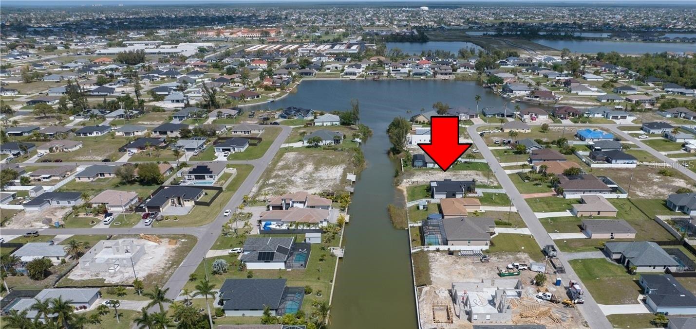 Discover the charm of waterfront living with this 0.244-acre FRESHWATER RESIDENTIAL LOT located in the peaceful Nova Canal neighborhood, leading directly to the scenic Honeymoon Lake in NW Cape Coral. This is your chance to build the WATERFRONT HOME of your dreams—with plenty of room for a pool! Spanning 10,629 sq ft (85 ft frontage x 125 ft depth), this rectangular lot offers ample space to design your perfect retreat in paradise. Enjoy the serenity of a quiet residential neighborhood, while still being close to everyday essentials including restaurants, grocery stores, pharmacies, schools, and hospitals. Located in a low-risk Flood Zone X, you’ll appreciate the peace of mind that comes with no flood insurance requirements—even with the canal just 250 feet away. Bring your kayak, canoe, or personal watercraft and explore Cape Coral’s vast freshwater canal system! This is an incredible opportunity to invest in your future and enjoy the Florida lifestyle you've been dreaming of. Public boat ramps nearby make it easy to access Matlacha Pass, San Carlos Bay, and the Gulf of Mexico, opening the door to endless boating and fishing adventures. Plus, with quick access to Pine Island Road, you'll enjoy convenient routes to I-41 and I-75, putting you within reach of top destinations like Venice, Siesta Key, Sarasota, Fort Myers, Naples, Marco Island, Punta Gorda, and multiple SWFL international airports. Don't miss your chance to make your vision of waterfront living a reality—this property checks all the boxes!