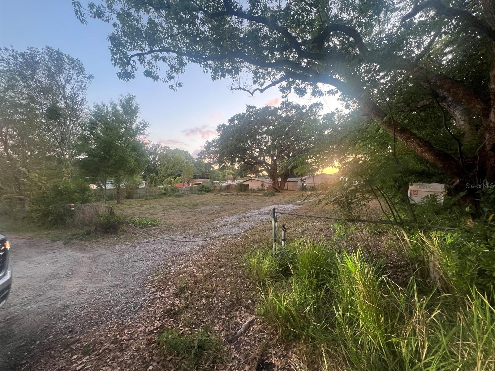 Fantastic opportunity to own a high and dry 0.35-acre residential lot, perfectly suited for a mobile home. This level parcel already has a working well and septic tank in place saving you time and money. A demolition permit was previously pulled when the former mobile home was removed, meaning no impact fees will apply if you place a new home of equal or smaller size. The property features a mature, shady tree and several smaller trees, offering both charm and natural privacy. Whether you're looking to set up a full-time residence or an affordable investment, this ready-to-go lot is a rare find!