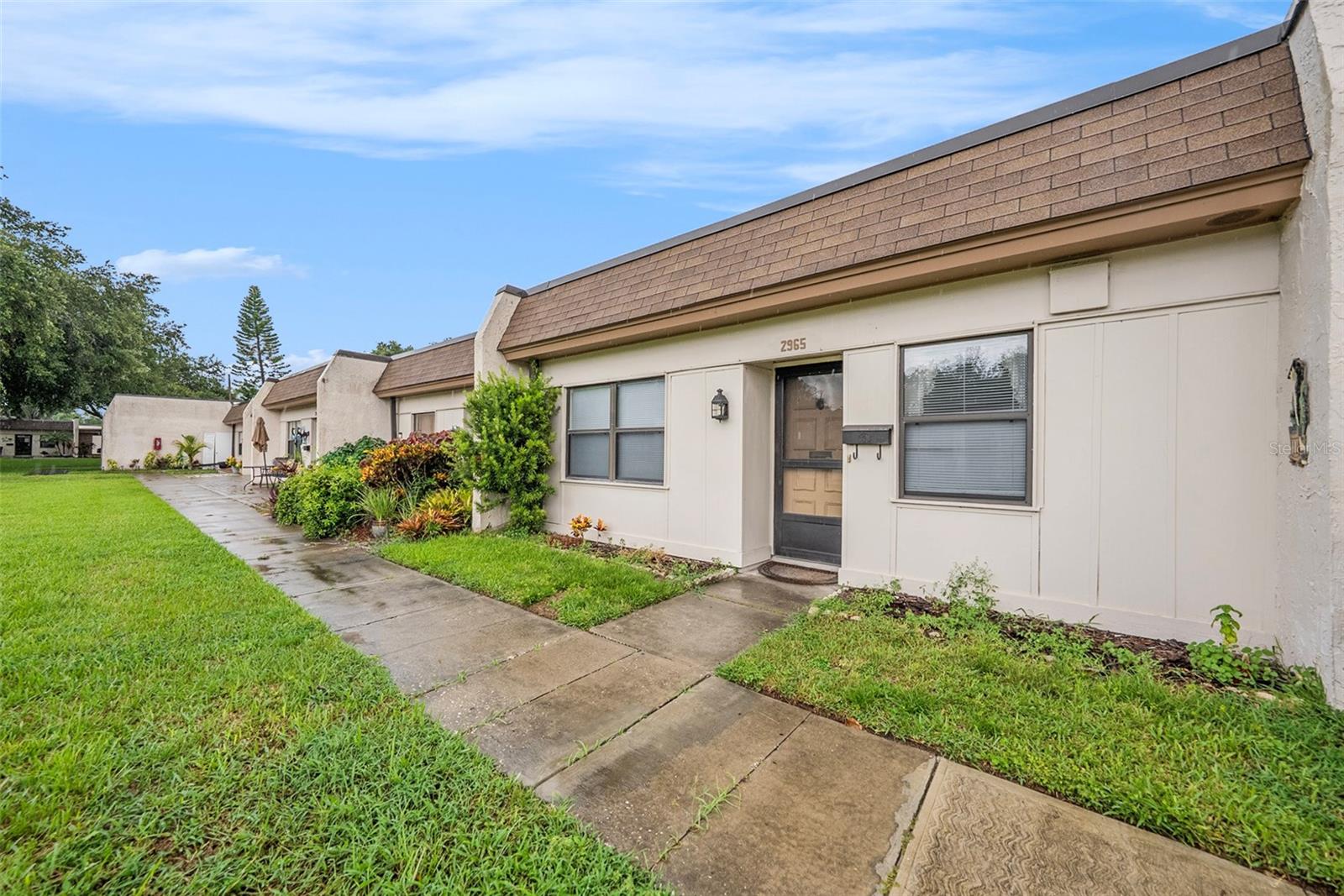 NON-EVACUATION ZONE, NON-FLOOD ZONE! Welcome to Mission Hill's Clearwater one of Clearwaters Best and most desirable 55+ communities. Come take a look at this high and dry 2 bed/2 bath condo that comes with a covered carport parking space and storage unit. The owners installed new carpet in the primary bedroom, new luxury vinyl plank in the entryway, kitchen, and primary bathroom. New electric panel and dishwasher as well. The washer/dryer does convey with the sale of the home and for extra peace of mind, the roof was replaced around five years ago. This is an active community with a pool, clubhouse, shuffleboard, and many activities like fitness equipment, bingo, ping pong tables and social events. Location Location! A short walking distance to Bayside Bridge Plaza where there is CiCi’s Pizza, Publix, Starbucks, Pauls Chicago Pizza and more. Also a short walk to Johnny’s Italian Restaurant and close to US-19 & Mcmullen Booth so getting around or heading to Tampa or St. Pete is an easy drive. Schedule your showing and come take a look today, you won’t be disappointed!