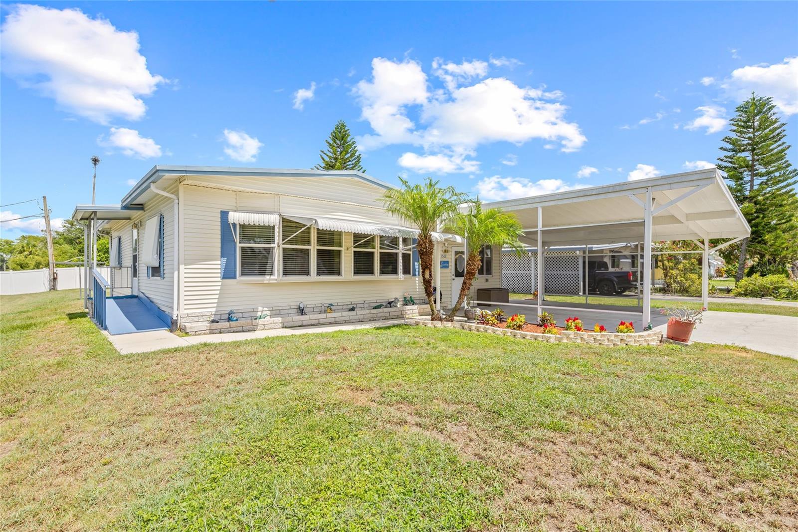 Welcome to your Florida retreat! Nestled at the end of a peaceful cul-de-sac, this charming 2 bedroom, 1.5 bath corner-lot gem offers the perfect blend of privacy, comfort, and vibrant community living. Imagine sipping coffee in your family room with a built-in coffee bar, or unwinding with lake views from your spacious backyard. You will own the mobile home and the lot! (No lot rent)
Designed for convenience, this home features an indoor laundry room, extended carport, wheelchair ramp, available parking for your camper, boat or RV and two storage sheds for all your seasonal needs, PLUS the roof has been recently recoated and sealed. The spacious lot provides plenty of outdoor space, while the quiet, friendly neighborhood offers a true sense of safety and community.
Enjoy a bonus lifestyle in this welcoming 55+ community, where weekly events, social gatherings, and activities make every day feel like a getaway and neighbors feel like extended family.
Whether you're escaping the cold or settling into retirement, this lakeside haven is calling your name.
