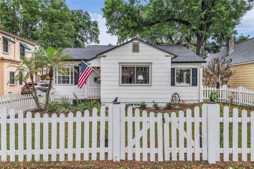 Don’t miss this beautifully renovated 3-bedroom, 2-bath home in one of downtown Orlando’s most sought-after neighborhoods—Delaney Park! Nestled on a picturesque, tree-lined brick street in the heart of Delaney Park, this charming residence perfectly blends timeless character with modern updates, all just a short walk to Lake Davis and the tennis courts, playground, and baseball fields at Delaney Park. From the moment you arrive, you’ll be captivated by the exceptional curb appeal featuring a welcoming front porch, brick driveway, and classic white picket fence. Inside, the home showcases original hardwood floors and abundant natural light throughout. The inviting living room flows seamlessly into the formal dining room and into the beautifully updated kitchen, complete with quartz countertops, stainless steel appliances, an induction cooktop, and a cozy built-in dinette. This home offers 3 spacious bedrooms plus a versatile bonus room—perfect for a home office, playroom, or den. The primary suite features an en suite bathroom and French doors that open to the backyard retreat. The second bathroom has also been tastefully renovated and is plumbed for a second vanity. Step outside to your private outdoor oasis, designed for both relaxation and entertaining. Enjoy a covered dining area, expansive deck, low-maintenance turf, and even a putting green. A detached bonus space with window A/C provides endless possibilities as a workshop, gym, or studio. Ideally located near Lake Davis, Lake Cherokee, Orlando Health/Winnie Palmer, SODO, Dr. Phillips Performing Arts Center, and Thornton Park, this home offers unmatched convenience to dining, entertainment, and recreation. Zoned for highly sought-after Blankner K-8 and Boone High School. Experience living on one of the very best of streets in Delaney Park—this is one you won’t want to miss!