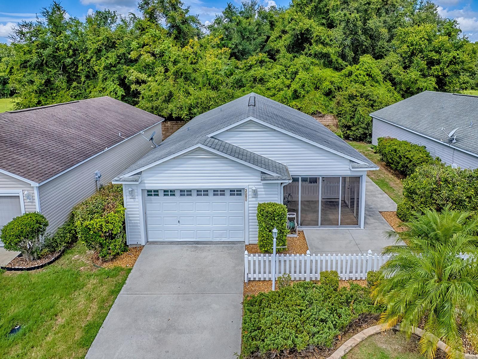 Imagine waking up each morning in a place where tranquility and community living blend seamlessly. Welcome to your new home—a beautiful 2-bedroom, 2-bath patio villa in the Village of Pinellas. With a prime location backing up to a serene stone wall, this property promises unparalleled privacy and a peaceful atmosphere, yet it remains close to the vibrant life you've come to expect from an active adult community.
As you approach the villa, you'll immediately notice the thoughtful landscaping that greets you—a harmonious arrangement of mature plants and edged rock beds that offer a welcoming first impression. It's enclosed front lanai with its brick/stone flooring really draws you in, inviting you to sit, relax, and enjoy the gentle Florida breezes.
Come inside to find new luxury vinyl plank flooring that stretches across the entire home, providing a foundation of warmth and elegance. The vaulted ceilings heighten the sense of space, while the plantation shutters add a touch of sophistication, allowing you to easily control the natural light that flows generously through each room.
The open kitchen is designed for both convenience and style, featuring white cabinets and ample counter space that make meal preparation a pleasure. The pantry is a practical touch, providing room to keep your kitchen essentials neatly stored away. For added function the adjacent dining area is perfectly situated for casual breakfasts or dinner parties with friends. The villa’s living room offers more than just a living space; it enhances that feeling of openness, while the central ceiling fan ensures comfort year-round. This space is ideal for everything from quiet evenings to entertaining guests. Each room flows naturally into the next, creating a cohesive living space that meets every need.
The bedrooms continue this theme of relaxed elegance. Each bedroom is a private retreat, complete with generous closet space. Both bathrooms offer contemporary fixtures and finishes.
What truly sets this property apart is its location within The Villages—a renowned 55-plus community that redefines active adult living. Known for its abundance of amenities, The Villages offers something for everyone. Whether you're interested in golfing, recreational clubs, or simply exploring the sprawling network of walking paths and nature trails, you'll find endless opportunities to engage and unwind.
Convenience is another key advantage of this villa. It's situated just a short drive from 466A, where you’ll find a wide range of shopping, dining, and healthcare services. It means you'll never have to venture far to satisfy your daily needs.
This villa is more than just a property; it’s a lifestyle choice that promises comfort, community, and convenience. Whether you’re retiring, investing, or looking for a seasonal retreat, embrace the opportunity to own a piece of paradise in a community designed for those who appreciate the finer things in life.
Ready to see it for yourself?