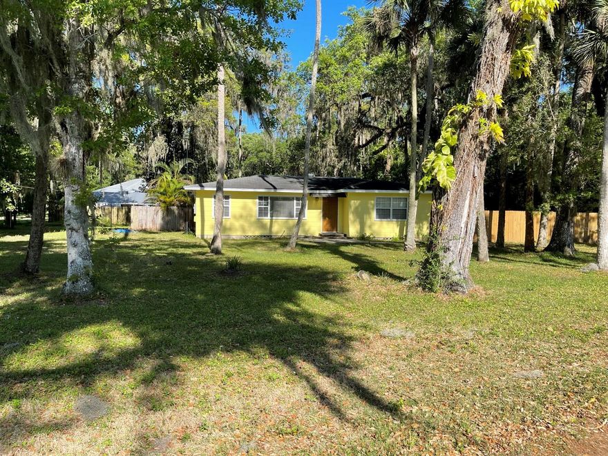 Enjoy this serene wooded oversized property with NO HOA! 2/1 Home with plenty of room to grow & ready for its new owners to make it their own. Real hardwood flooring throughout. This home invites you with recently upgraded real wood cabinets & granite countertops. New double pane windows throughout & a new AC. Rare find 150 x 150 double corner lot in highly sought after area of New Smyrna Beach. Close to schools, shopping, restaurants, and 10 minutes to the beach. Enjoy all that this town has to offer with weekly & monthly activities by the downtown area and the beach. All information intended to be accurate, but cannot be guaranteed. ;Water: City