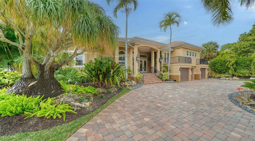 PRIVATE WATERFRONT OASIS in one of Siesta Key's most cherished neighborhoods. A circular drive and three-car garage welcome you to your 4/5 bedroom (all en suite), 5 full baths, office, and kitchen/family room combo overlooking the saltwater pool. The large, first floor owners' suite features a recently updated bathroom with soaking tub, and walk-in closet on the first floor. One of the additional bedrooms is a private guest suite with its own fridge, sink, and coffee bar. The outdoor pool area is very private and complete with a waterfall, large paver deck, an outdoor kitchen and screened dining area, and a short walk to your private dock and boat lift. The close proximity to the open waters of the intercoastal means "no bridges" to the bay, just minutes to the Gulf, and smooth sailing back to your protected dock that includes water and electric. This custom-built home has been reinforced with the highest-grade glass doors and windows, and a heavy duty generator so you can rest easy, regardless. Come see if this retreat is for you.