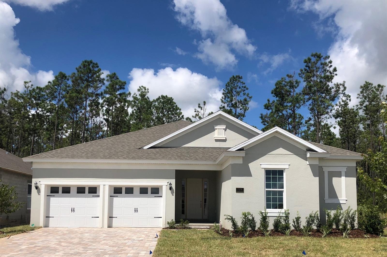 One or more photo(s) has been virtually staged. Tidewater Floorplan – 3,100 Sq. Ft. | 4 Beds | 2.5 Baths | 2-Car Garage | Oversized Lot | Move-In ReadyWelcome to the Tidewater– a thoughtfully designed, single-story home by Dream Finders Homes that perfectly blends luxury, functionality, and comfort. This brand new 2,687 square foot residence sits on an oversized lot, offering expansive indoor and outdoor living space, ready for immediate move-in.Key Features:4 Spacious Bedrooms: Designed for privacy and flexibility, including a luxurious owner’s suite with spa-like en-suite bathroom and large walk-in closet.2.5 Full Bathrooms: Modern finishes with quartz countertops, tile flooring, and upgraded fixtures throughout.Gourmet Kitchen: A chef’s dream featuring built-in stainless steel appliances, large center island, upgraded cabinetry, quartz countertops, walk-in pantry, and designer lighting – perfect for hosting or everyday meals.Open-Concept Living: The heart of the home flows seamlessly from the kitchen to the dining area and large family room, all overlooking the covered lanai for indoor-outdoor living.2-Car Garage: Ample space for two vehicles plus additional storage or hobby area.: Extra space for a future pool, garden, or play area—ideal for entertaining or relaxing outdoors.Move-In Ready: No waiting required. Price reduced, no incentives apply.