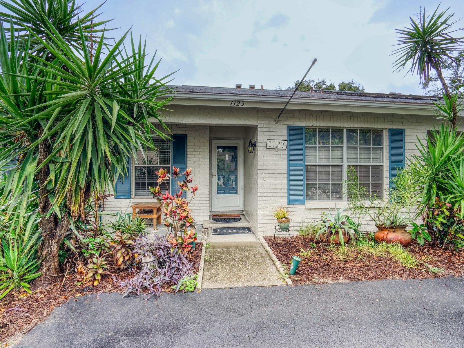 Freshly painted and well located 2 bedroom to bath villa style home in the heart of Safety Harbor. Entire interior freshly painted and professionally cleaned making this one move in ready. Updated kitchen with newer stainless steel appliances has pass through to the dining area and living area beyond. Primary bedroom in the rear has walk-in closet and en suite bath with double sink vanity and shower. Secondary bedroom, bathroom and laundry closet situated in front of the home providing for nice separation. Enclosed porch is a fantastic little bonus room ideal for an office or a play room. Step out back to a fully fenced private backyard. Two parking spaces right by your front door. The community has a pool and clubhouse and is located near the shores of Tampa Bay. Close to vibrant downtown Safety Harbor, Phillippe Park, shopping, restaurants and two airports, the location can't be beat!