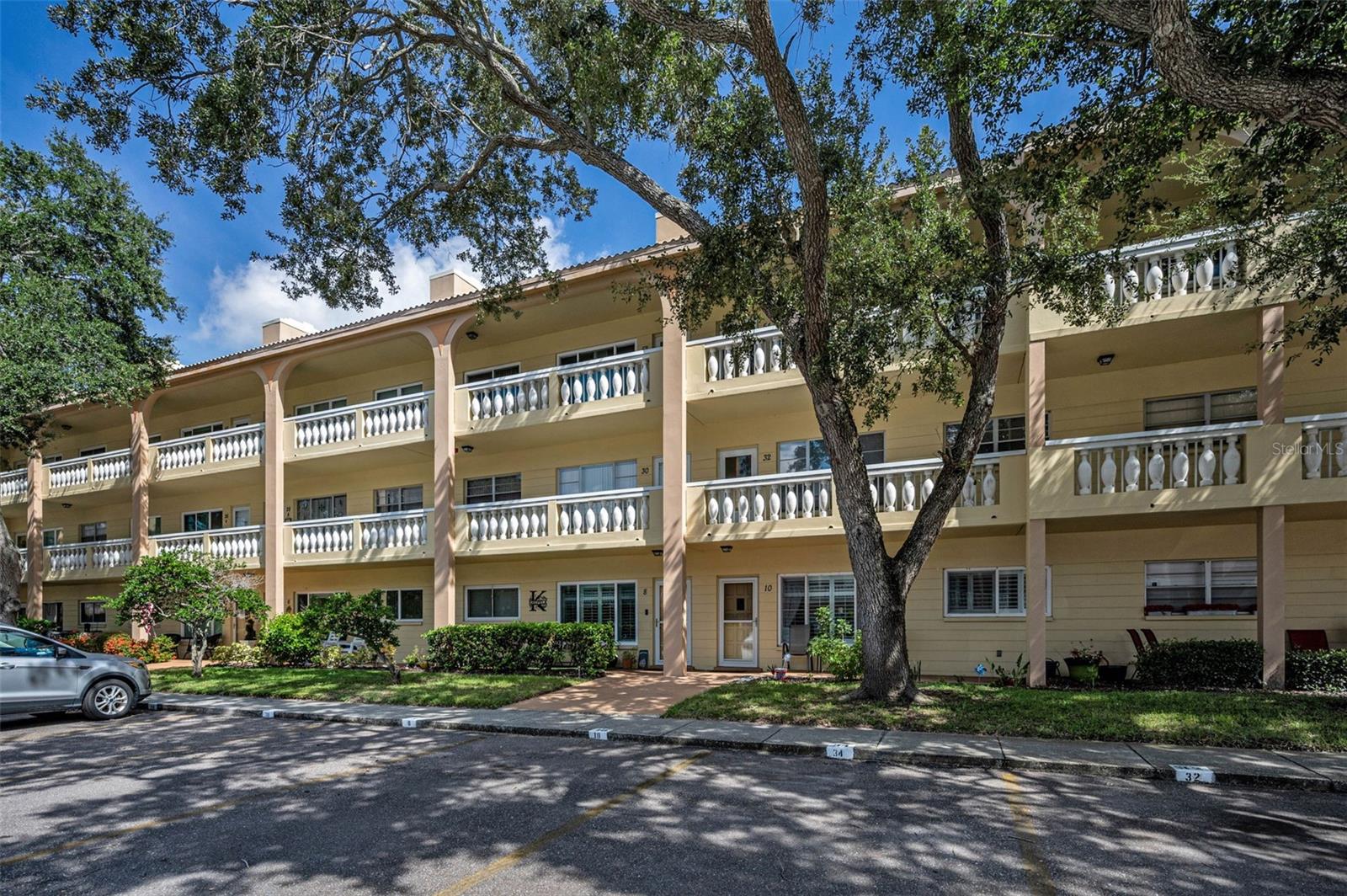 Welcome Home to Unit 52 in The Flamenco, Building 79! Step into this beautifully updated condo on the desirable West Side of On Top of the World! Located in a non-flood and non-evacuation zone! This inviting condo showcases luxury, vinyl flooring throughout the living room, dining area and two bedrooms with hurricane impact windows (2017/2023) and a newer HVAC system (2020)! The attractive, remodeled, eat-in kitchen features wood cabinetry, a stunning tile backsplash, granite countertops and Samsung stainless-steel appliances! Both bathrooms have been thoughtfully updated with modern cabinetry, tile flooring and new fixtures! Enjoy the convenience of an elevator building with your own assigned parking space plus ample guest parking! Life here is about more than just a beautiful condo—it’s about a vibrant, 55+ active lifestyle! Walk to the Westside Recreation Building where you can swim and "have a lot of activity"! Residents enjoy two private golf courses (9 and 18 holes) – no charge for owners, two heated swimming pools, tennis and pickleball, a modern cardio gym, a pet-friendly dog park with covered seating, hobby studios, a full wood shop, fitness classes, dancing, clubs, billiards and so much more! The Good Karma Café offers convenient "take-and-bake" meals and snacks!. All this, just minutes from the world-class beaches in Clearwater and Dunedin! You will certainly appreciate all the nearby shopping, dining and entertainment! Don’t miss your chance to own this move-in-ready condo in one of Florida’s most sought-after active adult communities! Easy commute to both Tampa and Clearwater/St. Pete airports! This property is being transferred by a leasehold estate deed! The Association requires approval! If financing, a 35% down payment is required.