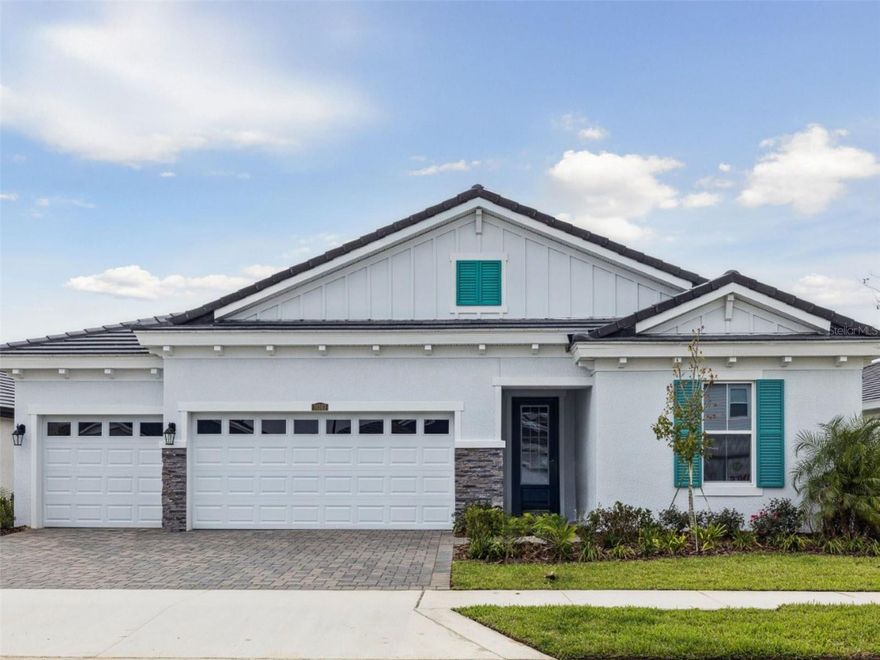 One or more photo(s) has been virtually staged. Islamorada I -
This Islamorada I is ready for move-in, designed to welcome you with an immediate sense of grand, open space! The home opens with an extended foyer that guides you into a grand room featuring soaring twelve-foot ceilings, which enhances the open feel. Picture yourself entertaining or simply relaxing in this magnificent setting, seamlessly connected to a gourmet island kitchen and charming café area. From here, the transition to your outdoor lanai is effortless, inviting you to enjoy the fresh air and create lasting memories. The heart of this home, the kitchen, boasts exquisite Sonoma Harbor cabinets and elegant Frost Whte MSI Quartz countertops, offering both beautiful design and durable practicality. Throughout the main living areas, you'll find resilient Polaris Plus LVP flooring, providing a perfect blend of style and practicality for everyday life. The Islamorada I is designed with versatility in mind. Beyond the impressive main living spaces, you'll discover generously sized secondary bedrooms, providing comfortable havens for family or guests. A dedicated formal dining and den space offers incredible flexibility, transforming easily into an intimate dinner setting, a productive home office, or whatever your lifestyle demands, while the oversized laundry room adds a touch of everyday convenience. Escape to your luxurious owner’s retreat, a private sanctuary designed for ultimate relaxation. This private haven features an expansive walk-in closet, ensuring ample storage for your wardrobe. The spa-like en-suite bathroom is complete with double vanities and a spacious walk-in shower, providing a serene escape at the end of each day. Listing Price amount for this Pending Sale includes Design and Structural Options.