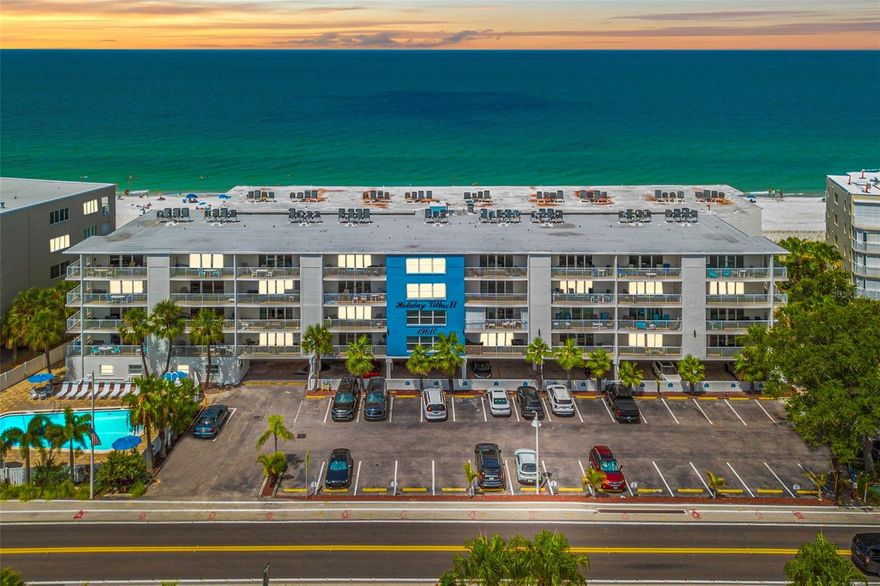 Beachfront Bliss at Holiday Villas II
Live the Gulf Coast dream at 19610 Gulf Boulevard #101, a first-floor, corner condo with direct beach access, wraparound balcony, and breathtaking Gulf views. This 1,100 sq ft, 2-bedroom, 2-bath retreat offers a bright open layout, tile flooring throughout, and a kitchen flowing into the living and dining areas—perfect for entertaining or sunset watching.
The primary suite includes an en suite bath, while the guest bedroom and second full bath welcome family and friends. Corner-unit perks mean extra windows, added privacy, and abundant natural light.
This fully furnished unit is ready to be your primary home or a rental source of income—your choice. Short-term rentals are allowed with a 4-day minimum. Holiday Villas II provides a heated beachfront pool, outdoor grill, covered parking, and elevator access, with monthly fees covering water, sewer, trash, cable, exterior maintenance, pest control, and pool care.
Enjoy the rare mix of lifestyle and opportunity—where every day ends with a postcard-perfect sunset.