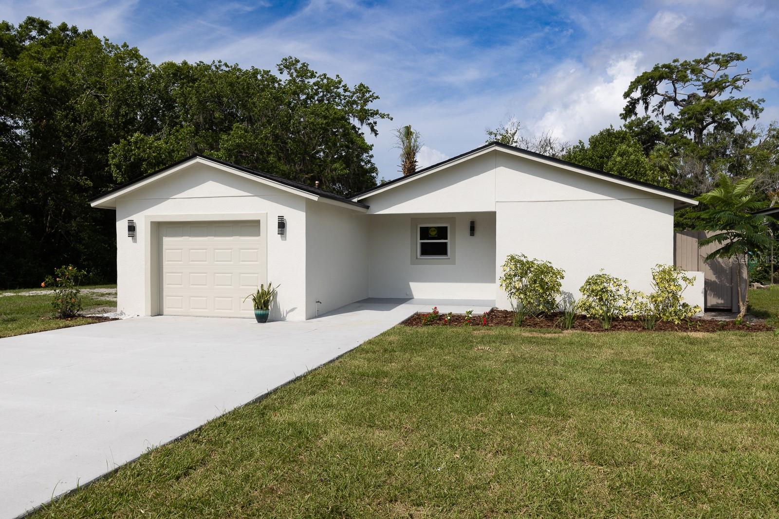Under contract-accepting backup offers. Welcome to better than NEW cute 3 bedrooms 2 bathrooms home with a stunning backyard, which is situated on a semi-private lot next to a Gee Creek in Seminole County . Absolutely everything in this house is new: PELLA DOUBLE PANE WINDOWS, AC UNIT, PEX PIPING, FLOORING, BOTH BATHROOMS. TEXTURE ON WALLS AND CEILING, ROOF, FENCE, KITCHEN, APPLICANCES, LIGHT FIXTURES, GARAGE DOOR WITH OPENNER, EXTERIOR AND INTERIOR SHERWIN WILLIAMS PAINT, You will be mesmerized by the European style stretch ceiling with built in lights in the living room and kitchen. The property welcomes you with a brand new extra wide driveway and a new sod. No HOA. Super convenient location close to shopping, RESTAURANTS, main highways and highly rated Seminole County schools.