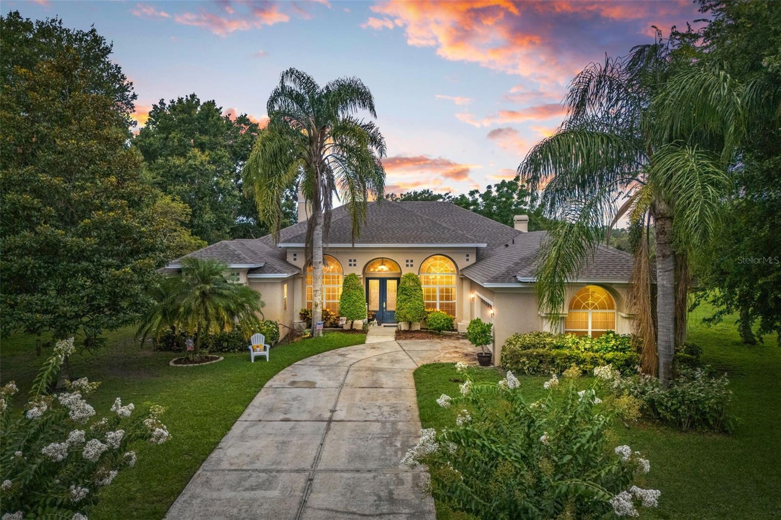 One or more photo(s) has been virtually staged. Have you been looking for a larger private lot to have your dream home on? Not far from downtown Mount Dora's amenities, and less than an hour to Orlando and attractions, This 4 bedroom 3 bath home is located conveniently off of CR 448A yet is quiet and peaceful and gives you that country living feeling. Solidly built concrete block stucco home sitting on 5.13 acres with 4 bedrooms and 3 full baths has plenty of room for your growing or extended family. The nicely appointed kitchen opens onto the the cozy family room with a fireplace and views of the land. There is eat in space between the kitchen and family room, in addition to a formal dining room that opens onto a formal living room. Sliders onto the covered and screened lanai make entertaining both inside and outside a breeze. The split bedroom plan allows for privacy for all, the primary suite is a calming get away with a fireplace, a sitting area with French doors that open to the covered lanai, and a large ensuite bath with a huge walk in closet. The level lot is partially fenced and there is plenty of room to bring your horses or other animals tucked far in from CR448A this private paradise is just waiting for you. No HOA or CDD and shed does not convey. NEW ROOF 2025!