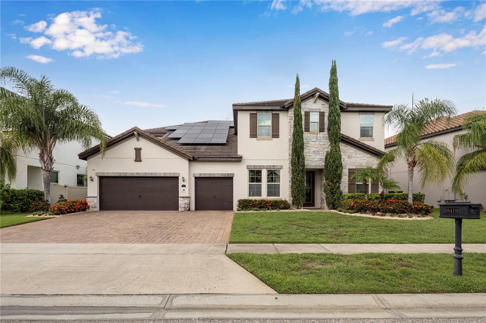 Pristine elegance meets modern sophistication in this exceptional residence, perfectly situated in the highly desirable Parkside community in the heart of Dr. Phillips. From the moment you step through the grand double doors, you’re welcomed by gleaming travertine floors, soaring ceilings, and an abundance of natural light that creates an immediate sense of luxury and warmth.
Spanning over 5,400 sq ft across two levels, this home offers 7 bedrooms, 6.5 bathrooms, and a resort-style pool on a generous quarter-acre lot. The first floor showcases an open-concept design, seamlessly connecting the formal dining and living areas with an extended chef’s kitchen — featuring an oversized island, custom cabinetry, and a walk-in pantry designed for both beauty and function.
The primary suite on the main level is a true retreat, complete with a spa-like bath, expansive walk-in closet, and a charming sitting room with French doors overlooking the pool. A home office, flexible enough to be used as a guest suite, and a convenient laundry room complete the main floor.
Upstairs, the glamour continues with a spacious loft with wet bar and beverage fridge, perfect for movie nights or game evenings. Five additional bedrooms include a second master suite, two en suite bedrooms, and a Jack & Jill configuration — each boasting spacious walk-in closets. A second laundry room provides ease and convenience for the entire household.
Step outside to your private oasis: a sparkling pool and spa, a fully equipped summer kitchen, and abundant privacy — all designed for relaxation and entertainment. A dedicated pool bath ensures comfort for family and guests alike.
The location is simply unmatched: minutes from world-class dining, shopping, theme parks, and major highways, this home offers the perfect balance of convenience and exclusivity.
Meticulously maintained and featuring one of the most desirable floor plans in Parkside, this residence feels like new — elegant, pristine, and truly one of a kind. From the first step inside, you will fall in love.