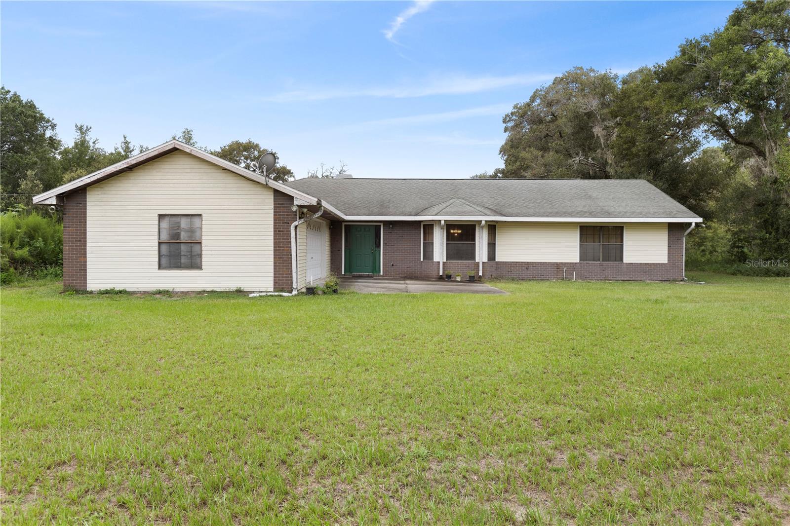 Private Country Living with Modern Comfort on 5 Acres in Spring Hill
Welcome to 18321 McMullen Road, where peace, space, and natural beauty come together in this charming 3-bedroom, 2-bathroom home set on five fully cleared and usable acres. Located in the quiet countryside of Spring Hill, this property offers the perfect blend of rural living and modern convenience, just minutes from parks, trails, shopping, and dining.
Step inside to discover a bright open layout with vaulted ceilings, natural wood accents, and a cozy stone fireplace that anchors the spacious living area. The well-designed kitchen offers ample cabinet space and flows seamlessly into the dining and living rooms, creating an ideal space for everyday living and entertaining. The primary bedroom is a true retreat, featuring a spa-inspired bathroom with an oversized soaking tub surrounded by tile and windows, offering serene views of the private landscape.
This home has been thoughtfully upgraded with a brand-new HVAC system in 2025 and a new electrical panel installed in 2024, providing peace of mind and energy efficiency. The interior layout, full of natural light and warm textures, is complemented by the expansive outdoor space that offers endless possibilities.
Bring your vision to life with room for gardens, animals, recreational toys, RVs, workshops, or future additions. Whether you're dreaming of a hobby farm or simply want more room to roam, this property delivers both flexibility and freedom.
Enjoy easy access to Florida’s best outdoor destinations, including Crews Lake Wilderness Park, Jay B. Starkey Wilderness Park, and the scenic Suncoast Trail. Take a short drive to Weeki Wachee Springs for kayaking and crystal-clear springs, or head west to Pine Island and Hudson Beach for relaxing coastal escapes. Everyday essentials are just minutes away, with Publix, Walmart, Target, and local favorites nearby. Plus, with quick access to US-41 and the Suncoast Parkway, commuting to Tampa, Brooksville, or the airport is a breeze.
This rare opportunity offers the space, updates, and lifestyle you’ve been looking for. Schedule your private showing today and experience the best of country living with modern comfort.