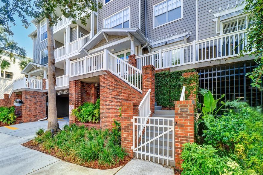 One or more photo(s) has been virtually staged. Location is everything.  Come and view this privately nestled two-bedroom, two-bathroom second floor condominium in Hyde Park Village with all the convenience of shops, restaurants, parks and more just steps away.  This charming condo is one of five walk up units with three porches and three outside doors. Completely remodeled to include hardwood engineered floors throughout the main living areas and bedrooms.  New ceiling fans with remotes.  A/C unit replaced in 2019 and hot water heater replaced in 2021. New impact windows and doors. The kitchen boasts quartz countertops and soft close drawers and cabinets. Large seating area island with built in shelves.  All appliances updated and are stainless steel. Stackable washer & dryer included. Both spacious bedrooms have walk-in closets and access to full bathrooms.  The two luxurious bathrooms boast tile floors, quartz counters, new mirrors, cabinets, toilets and sinks. One bathroom has a glassed-in stand-up shower and the other bathroom a whirlpool tub. Neutral shades and drapes in living room and bedrooms to stay with unit. The Hyde Park Walk community includes a fitness center, elevator, serene pool, outdoor gas grilling and gazebo, business center, cluster mailbox and package room and an on-site property management office. You won’t have to worry about security or trying to find parking.  This unit has one assigned parking space ideally located in the center of the parking garage and an additional guest parking space within the gated garage as well as bike storage. This unit also has a 5X5X9 extra storage room located on the 4th floor.  Call this condominium home and start enjoying the Hyde Park lifestyle.