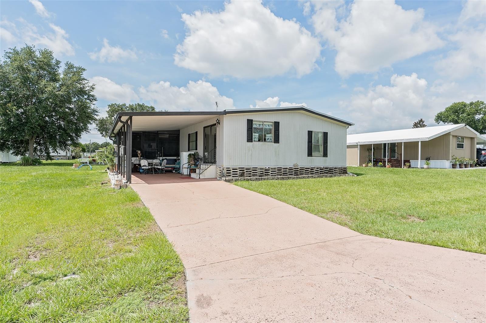 ** BEST DEAL IN TOWN – SPACIOUS 2 BED / 2 BATH MOBILE HOME WITH TONS OF EXTRAS!
Welcome to your next home in sunny Central Florida! This charming 2-bedroom, 2-bath mobile home offers a COMFORTABLE , OPEN LAYOUT with generous living spaces, ample storage, and a ton of value-added features. Located in a quiet, friendly CO-OP community with NO LAND RENT, this property is truly a hidden gem.
* Highlights Include:
** Newer A/C (only 4 years old)
** Roof less than 10 years old
** Low monthly fee of just $46 – includes land lease and access to amenities
** Spacious 10x12 shed with electric – perfect for storage or a hobby space
** Large lot with screened-in porch – ideal for relaxing outdoors
** Dining area with built-in hutch just off the kitchen
Inside, you'll find a private primary suite featuring a walk-in closet, a dedicated makeup vanity, and an ensuite bath with a walk-in shower. The guest bath includes a tub/shower combo, and all appliances convey – including the dryer.
** Enjoy peace of mind with new water lines being installed throughout the community!
** PLUS – the seller is offering a $10,000 Buyer Credit toward the replacement of some sub floors & all new flooring to be installed after closing – your choice, your style!
** Community Amenities: • Renovated clubhouse
• Shuffleboard courts • Community pool
• Engaged and welcoming neighbors
** Unbeatable Location:
• Minutes from downtown, shopping, medical centers, and golf
• Easy access to Tiger Stadium for Spring Training baseball
• A short drive to Tampa, Orlando, theme parks, and Florida’s gorgeous beaches!
Schedule your showing today and see if this is the Florida home you've been waiting for!