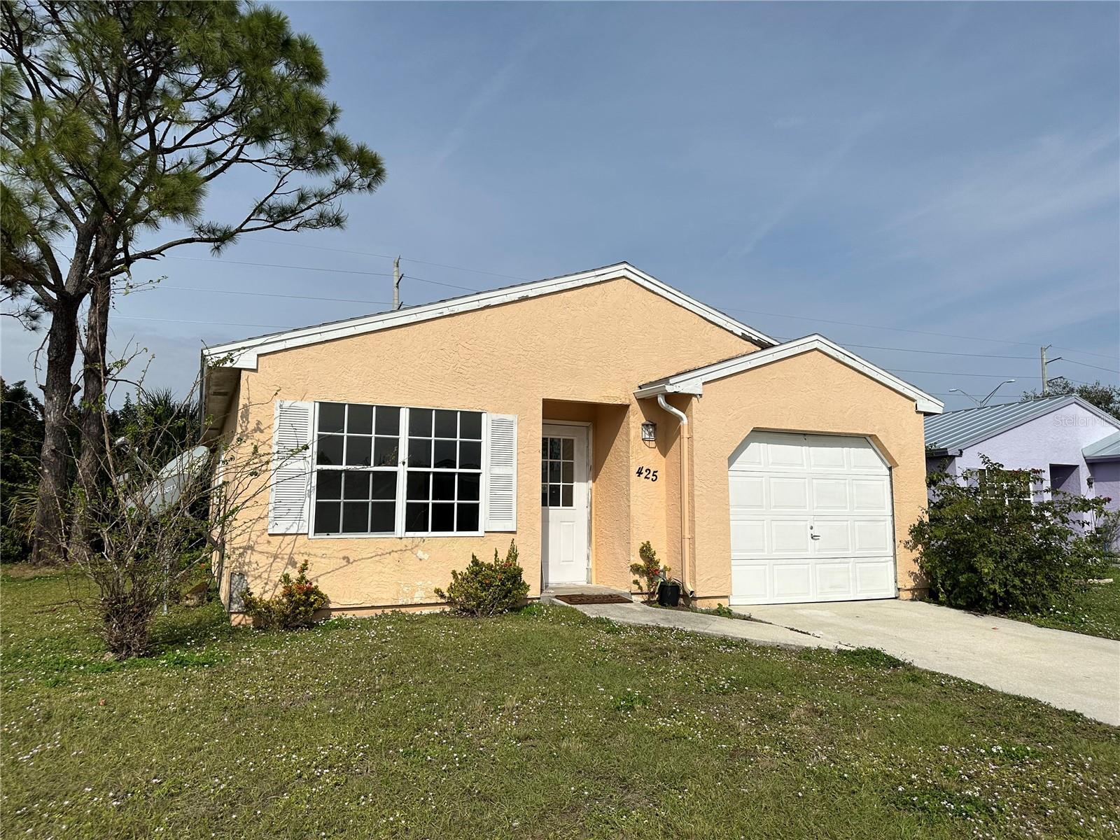 Welcome to your home in the heart of Port Charlotte! This charming single-family home offers the perfect blend of comfort and convenience, boasting a host of modern updates and a prime location. Step inside to a beautifully updated interior featuring a new kitchen with appliances, ideal for preparing meals and entertaining guests. The spacious living area creates a warm and inviting space for relaxation and socializing. With two bedrooms and two full bathrooms, including a primary suite with an updated en-suite bath, this home provides both privacy and function. Ceramic tile flooring throughout ensures durability and easy care, while large windows fill the home with natural light. A one-car attached garage offers added storage and convenience. Beyond the home itself, ownership includes access to the Oak Hollow Homeowners Association amenities. Residents enjoy a clubhouse with a fitness center, community pool, tennis and pickleball courts, basketball, shuffleboard, and a game room, as well as planned social activities. Tree-lined streets, walking areas, and a welcoming community atmosphere make Oak Hollow one of Port Charlotte’s most desirable neighborhoods.Located close to shopping, dining, and entertainment, this home combines modern comfort with community living at its best.