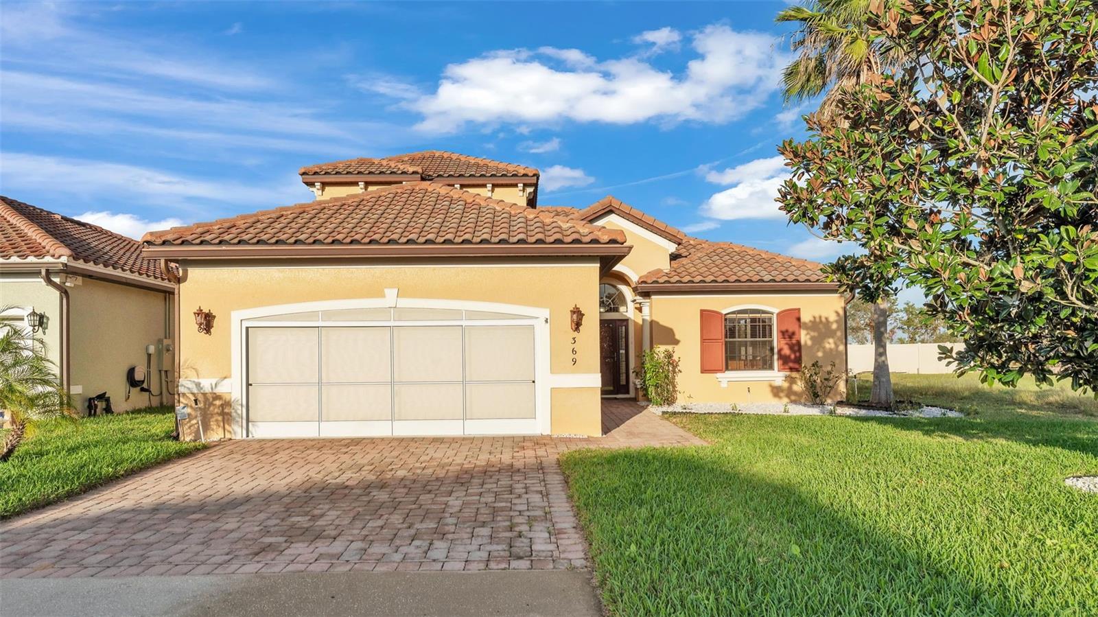 Welcome to Villa Sorrento! This upgraded 5 bedroom, 3 bath pool home checks every box—live here full-time, enjoy it as a vacation escape, or run it as a short-term rental. The open, airy layout flows to a private screened pool & spa with a newer heater (2020) and pump, perfect for year-round fun. Inside, the kitchen features a removable butcher-block island. Comfort and efficiency shine with a high-efficiency Rheem system and true dual-zone climate control (upstairs/downstairs). A terra-cotta tile roof adds long-term durability. Thoughtful extras include a storm door at the front entry, a powered solar screen garage door for privacy and cooler temps, and pre-installed plumbing for a whole-home water filtration system. Villa Sorrento offers a low-fee, well-maintained setting close to shopping, dining, and major attractions. Zoned for both primary living and short-term rentals—giving you options now and later. Come see it today!