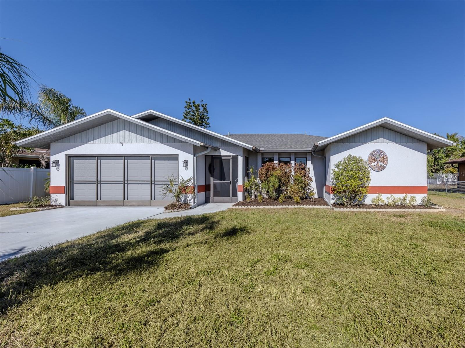 Welcome to this beautifully renovated pool home that checks every box! Located in a prime North Port neighborhood near shopping, dining, and entertainment, this 3-bedroom, 2-bathroom gem offers modern upgrades and an inviting open-concept floor plan.
From the moment you step inside, you'll be wowed by vaulted ceilings, abundant natural light, and all-new flooring throughout. The spacious living area seamlessly connects to the brand-new kitchen, featuring sleek cabinetry, sparkling countertops, and stainless steel appliances—a true centerpiece for entertaining.
The split floor plan offers privacy and functionality. Two generously sized bedrooms, each with walk-in closets, are paired with a remodeled bathroom on one side of the home. The extra-large master suite on the opposite side is a luxurious retreat, complete with two walk-in closets and a fully updated ensuite bathroom.
Outdoor living is a dream with a newly resurfaced pool, a fresh pool pump, and a spacious screened lanai perfect for relaxing or entertaining. The yard includes a wired shed, offering endless possibilities for a workshop or extra storage.
With a 2022 roof, 2021 septic system, fresh paint inside and out, and a long list of upgrades, this home is truly move-in ready. Don't miss your chance to own this North Port beauty—schedule your private tour today!