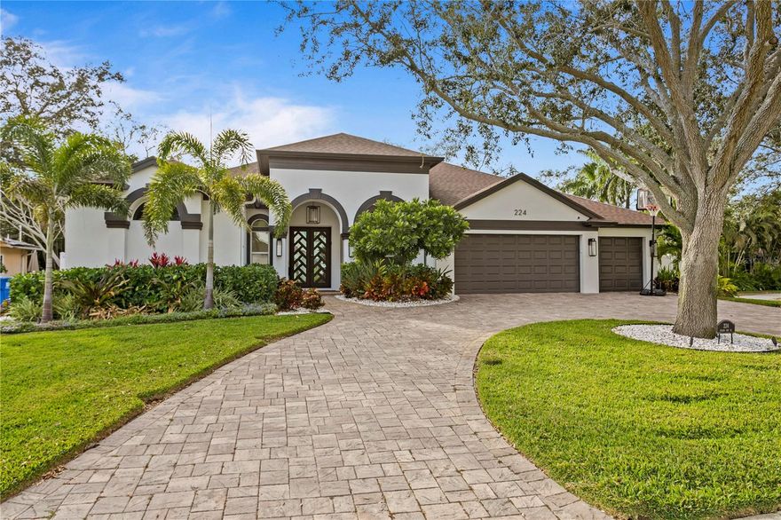 New New New!  This 2015 custom home has just undergone 8 months of renovations and $750K+ in high end updates that transformed this property into an amazing single story coastal contemporary dream house.  An ideal location on Snell Isle, Toledo Way NE has a great elevation (never flooding or water pooling) and is lined with other gorgeous multi-million dollar homes.  Just a block to Brightwaters Blvd makes it THE IDEAL location and house for a buyer that wants top of the line everything.  The current owners reconstructed the layout so that it is open and functional adding a pantry, mud room and 5th bedroom with closet (that is currently an office.)  Gorgeous finishes with all new flooring throughout (Coretec plus luxury vinyl in Ellidy Oak) an incredible custom kitchen rebuilt completely with all new cabinets, fixtures, lighting, appliances, Cambria 2.5" Quartz countertops with waterfall and an incredible custom built and massive wall feature to highlight the clean lines and natural textured style accented by gorgeous wood beams in the living room. It's a WOW.  A new whole house generator and turf and fencing for the side and backyard.  New epoxy finished garage floor.  New security system and cameras. The incredible master bathroom with bidet water closet and walk-in closet were completely rebuilt and create THE BEST primary suite you have seen on Snell!  The one story layout feels great and opens to the screened patio/ pool area and outdoor kitchen making the outside another incredible room to enjoy year round.  2015 roof, new AC's, all new copper pipes, water filtration and water softener, new painting inside and out, custom landscaping and exterior lighting.  Nothing was untouched and there is nothing left to do.