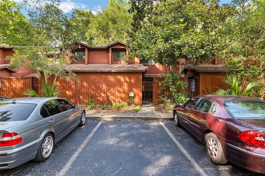 Set within the vibrant pulse of Gainesville, this inviting two-story condo brings together comfort, character, and an easygoing sense of livability that feels increasingly rare. Thoughtfully designed with 2 bedrooms and 2 full bathrooms positioned across separate levels, the layout creates a natural balance between connection and privacy. Sunlight moves freely through the living spaces, while the upper level suite overlooks the room below, adding dimension, openness, and an architectural charm that gives the home its distinct personality. Everyday life feels uncomplicated here. Durable vinyl flooring anchors the main living spaces with warmth and practicality, while soft carpeting upstairs creates a quieter, more relaxed retreat. A tiled entry welcomes guests with an immediate sense of care and intention. The bonus room offers flexibility for creative pursuits, a home office, reading lounge, or additional guest space, adapting easily to changing rhythms and routines. One of the home’s most memorable features lives just beyond the screened porch, where in unit laundry transforms an everyday task into something unexpectedly enjoyable. Fresh air drifting through the screens, coffee in hand, and the ease of staying entirely within the comfort of home creates a small luxury that quickly becomes indispensable. Outside, mature greenery, two sparkling community pools, a volleyball court and tennis courts invite an active and connected lifestyle just steps from the front door. Moments from the University of Florida, HCA North Florida Hospital, Shands, the VA Hospital, shopping, restaurants, and Gainesville’s growing cultural energy, the location places daily conveniences and community connection within easy reach. Warm, functional, and full of personality, this residence offers a refreshing alternative to the expected, a home that feels both grounded and uplifting from the moment the door opens.