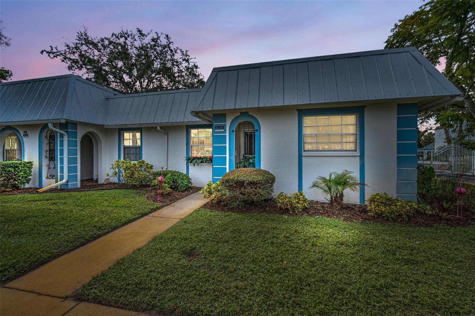 LOCATED IN THE GARDENS OF BEACON SQUARE! This UPDATED 1032 SQ FT 2 Bedroom 2 Bath and 1 car carport is nestled in the vibrant 55+ Gated Community directly across from the club house!! Kitchen has gleaming stainless-steel appliances providing a chic, functional space for all your culinary creations. Beautiful Laminate flooring flowing through most of home. With its modern touches, generous living spaces, and ideal layout, this home is perfectly suited for a vibrant, low-maintenance lifestyle in a welcoming community Step inside and discover an inviting great room, enhanced by newer laminate flooring that adds warmth and style throughout the main living areas. The updated kitchen shines with contemporary finishes, making meal preparation a delight while providing a wonderful space to gather with friends or family. The open-concept design offers a natural flow between the living, dining, and kitchen areas, creating a sense of spaciousness within the 1,032 square feet interior. Retreat to the impressive LARGE primary bedroom, where comfort meets function. Here, you’ll find laminate flooring, a large walk-in closet for all your storage needs, and a private en suite bathroom that offers a peaceful sanctuary at the end of the day. The guest bedroom also features laminate flooring and is located conveniently near the updated guest bathroom—perfect for overnight visitors or a flexible space for hobbies or a home office. Beautiful Florida room with storage closet. and outside brick patio for relaxing, Though the lot size is designed for minimal exterior upkeep, you’ll enjoy the carefree lifestyle this condo affords. Gardens of Beacon Square is a maintenance free gated community which features a heated pool & recreation center with many social activities, clubhouse, library and shuffleboard courts, laundry facility, Cable, internet, water, sewer and trash are all include in the condo fee as well! This is more than just a home; it's a lifestyle tailored to ease and enjoyment. Roof 2023...Come see this Amazing END UNIT CONDO TODAY!!