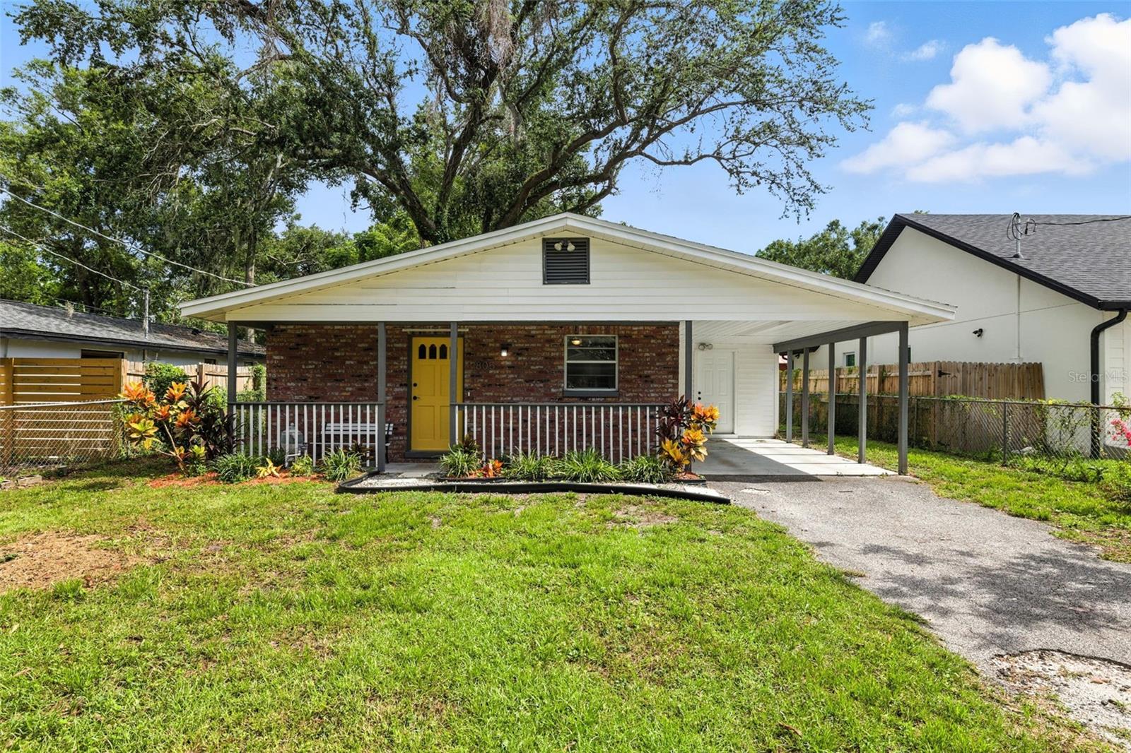Welcome to this Seminole Heights gem tucked away on a quiet dead-end street surrounded by new construction. With fresh curb appeal and thoughtful updates throughout, this home offers the perfect blend of charm, functionality, and extra space where it counts. Step inside to an open-concept layout featuring brand new flooring in the kitchen, dining, and living areas. The updated kitchen boasts granite countertops, shaker-style cabinets, stainless steel appliances, and a bar-height peninsula, perfect for casual meals or entertaining guests. The spacious primary bedroom offers room for a sitting area and features a massive walk-in closet. The second bedroom provides flexibility for guests, a home office, or a cozy den. Out back, the fully fenced yard offers mature trees, privacy, and a large storage shed. There is also a bonus storage room off the covered carport, perfect for a workshop, hobby space, or additional storage. Located just minutes from local favorites like The Corner Club, Gangchu, Rolling Mullet, and Three Coins Diner, and only 10 minutes to Downtown Tampa and 15 to 20 minutes to Tampa International Airport, this home puts you right in the heart of one of Tampa’s most vibrant and evolving neighborhoods. Roof replaced in 2023 for added peace of mind. Don’t miss your chance to call it yours!